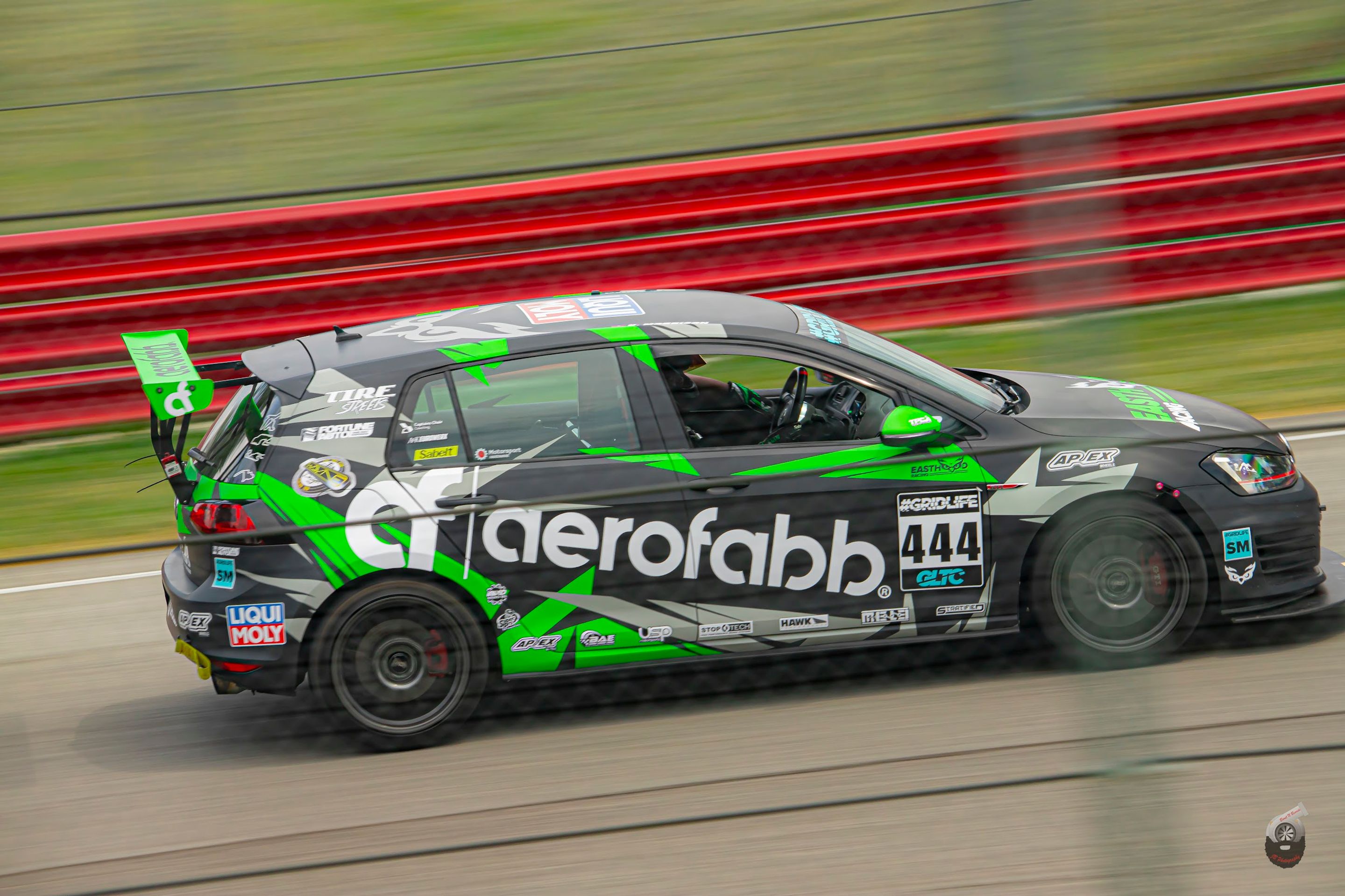 Race Livery VW MK7 GTI with 18" SM-10 Apex wheels in Satin Black