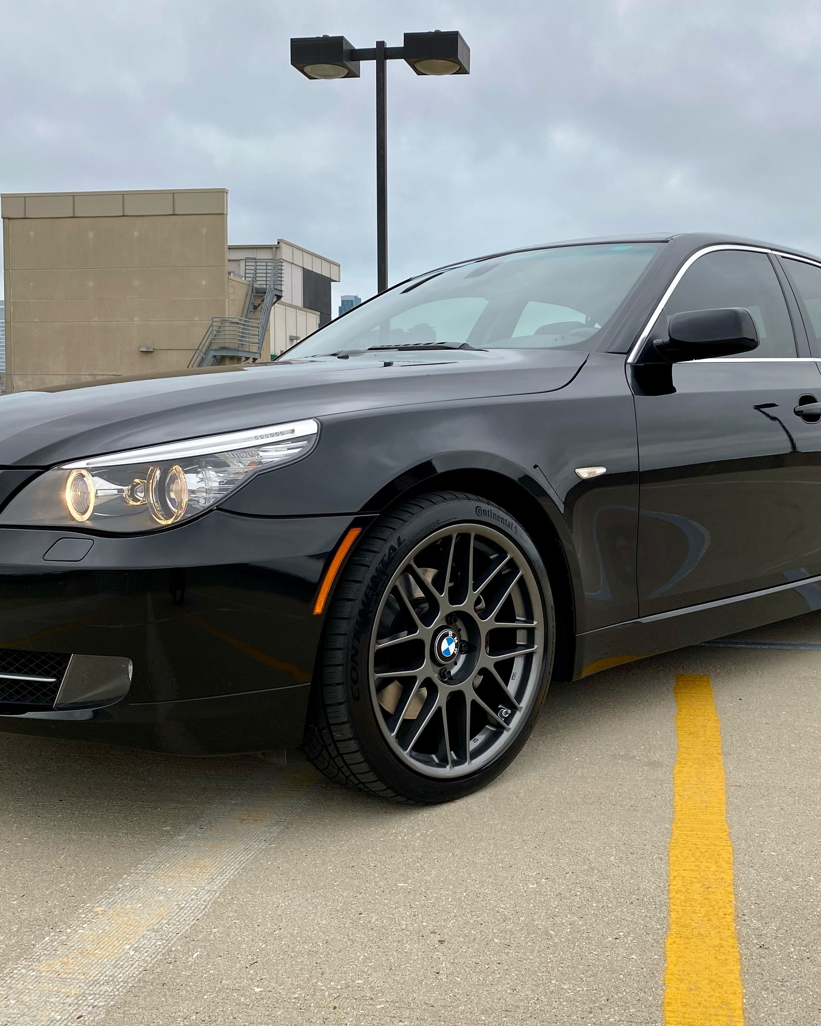Black BMW E60 Sedan 5 Series with 19" ARC-8 Apex wheels in Anthracite