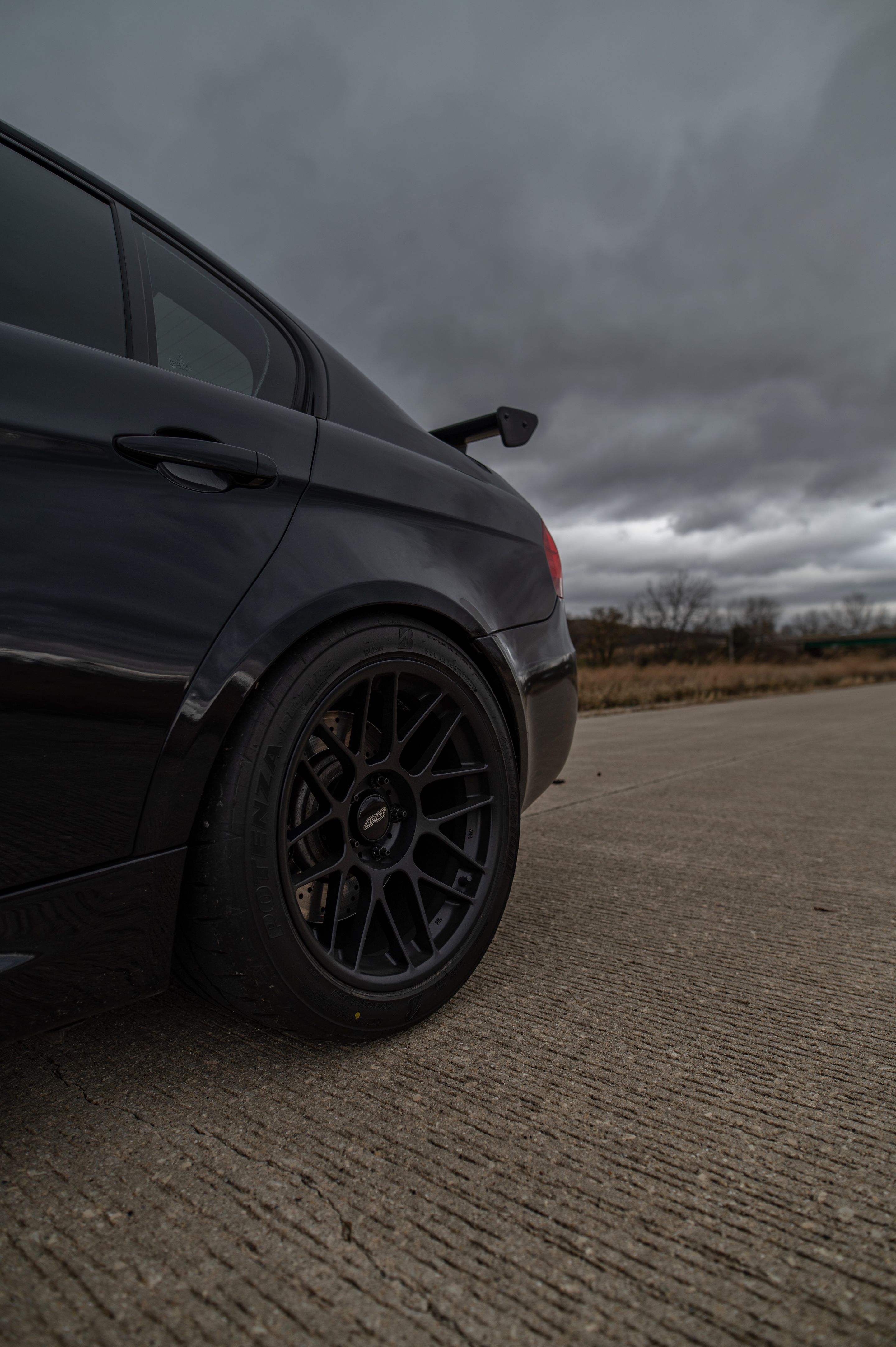 Black BMW E90 Sedan M3 with 18" ARC-8 Apex wheels in Satin Black