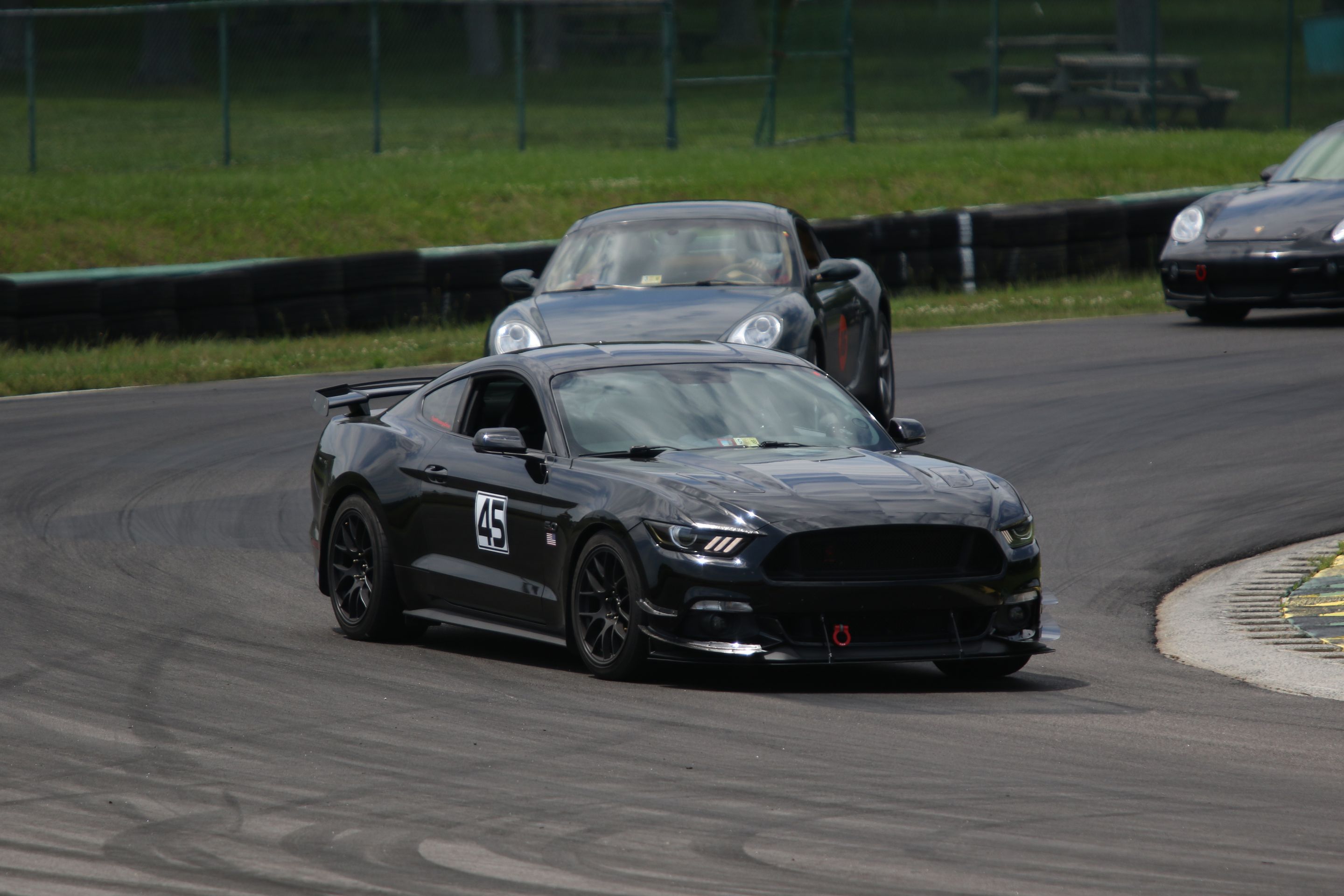 Black Ford S550 Mustang GT with 18" EC-7 Apex wheels in Satin Black