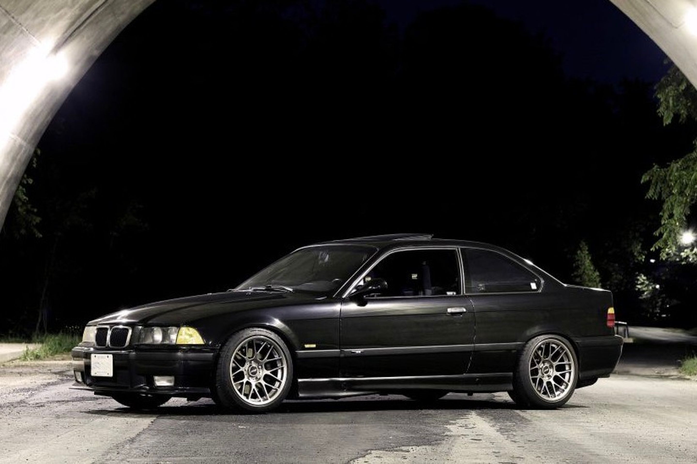 Black BMW E36 M3 with 17" ARC-8 Apex wheels in Hyper Black