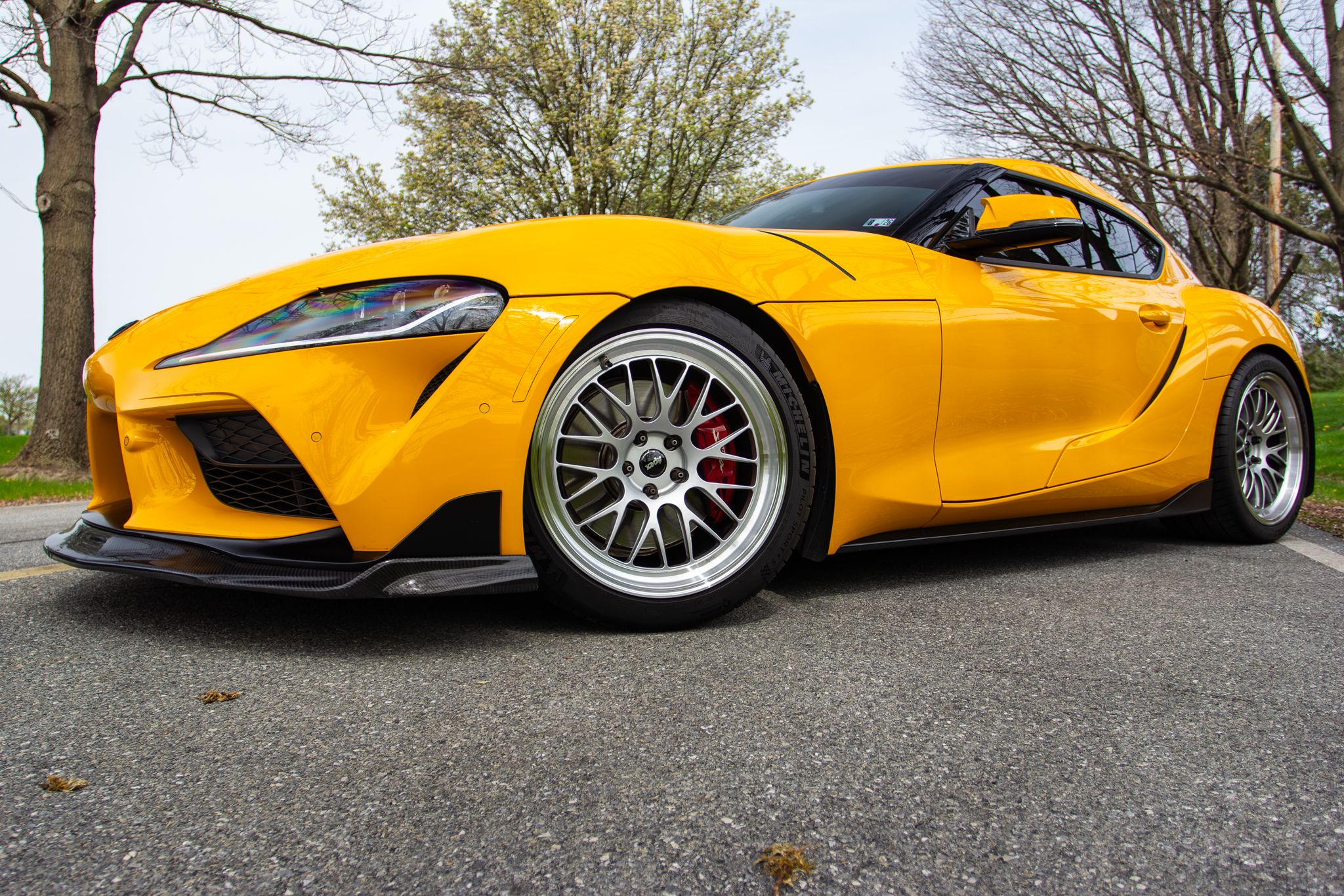 Yellow Toyota GR Supra with 19" ML-10RT Apex wheels in Machined Lip Race Silver