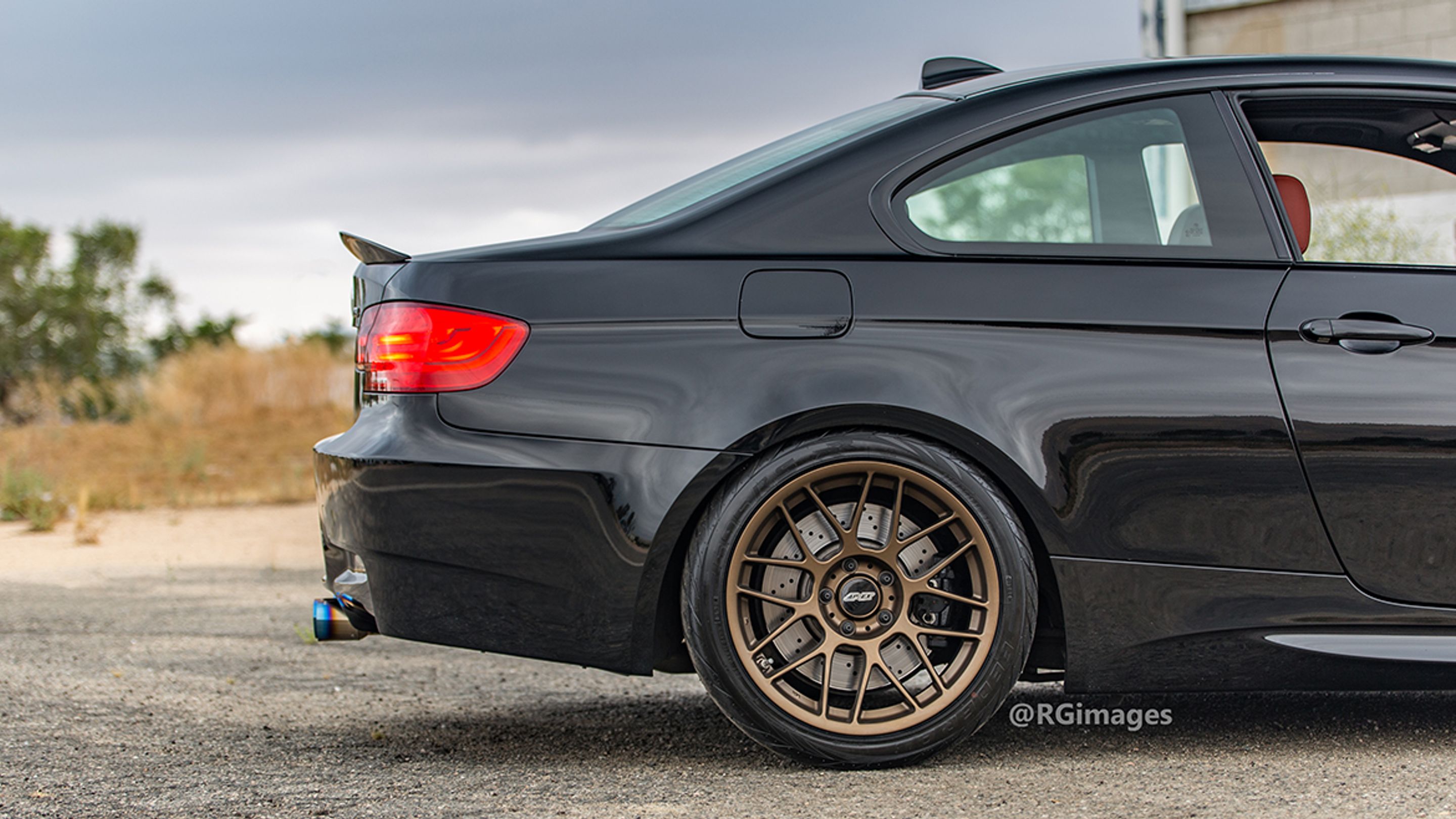 Black BMW E92 Coupe M3 with 18" ARC-8 Apex wheels in Satin Bronze
