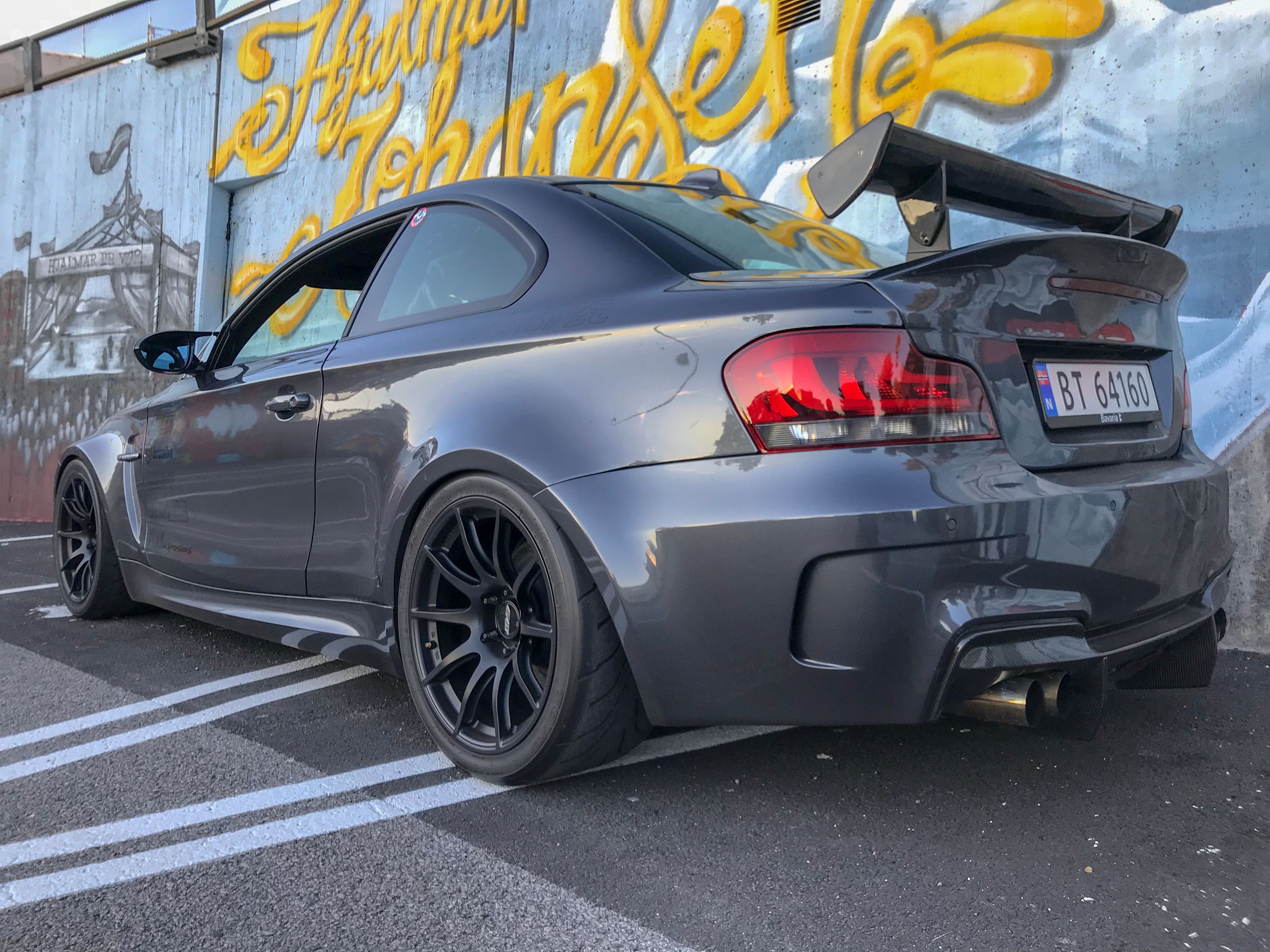 Grey BMW E82 1M with 18" SM-10 Apex wheels in Satin Black