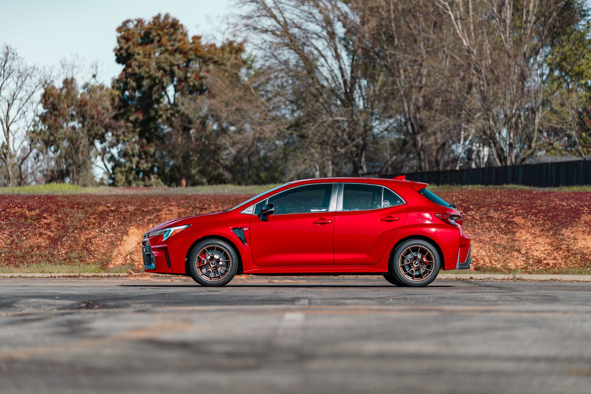 Red Toyota GR Corolla with 17" VS-5RS Apex wheels in Satin Bronze
