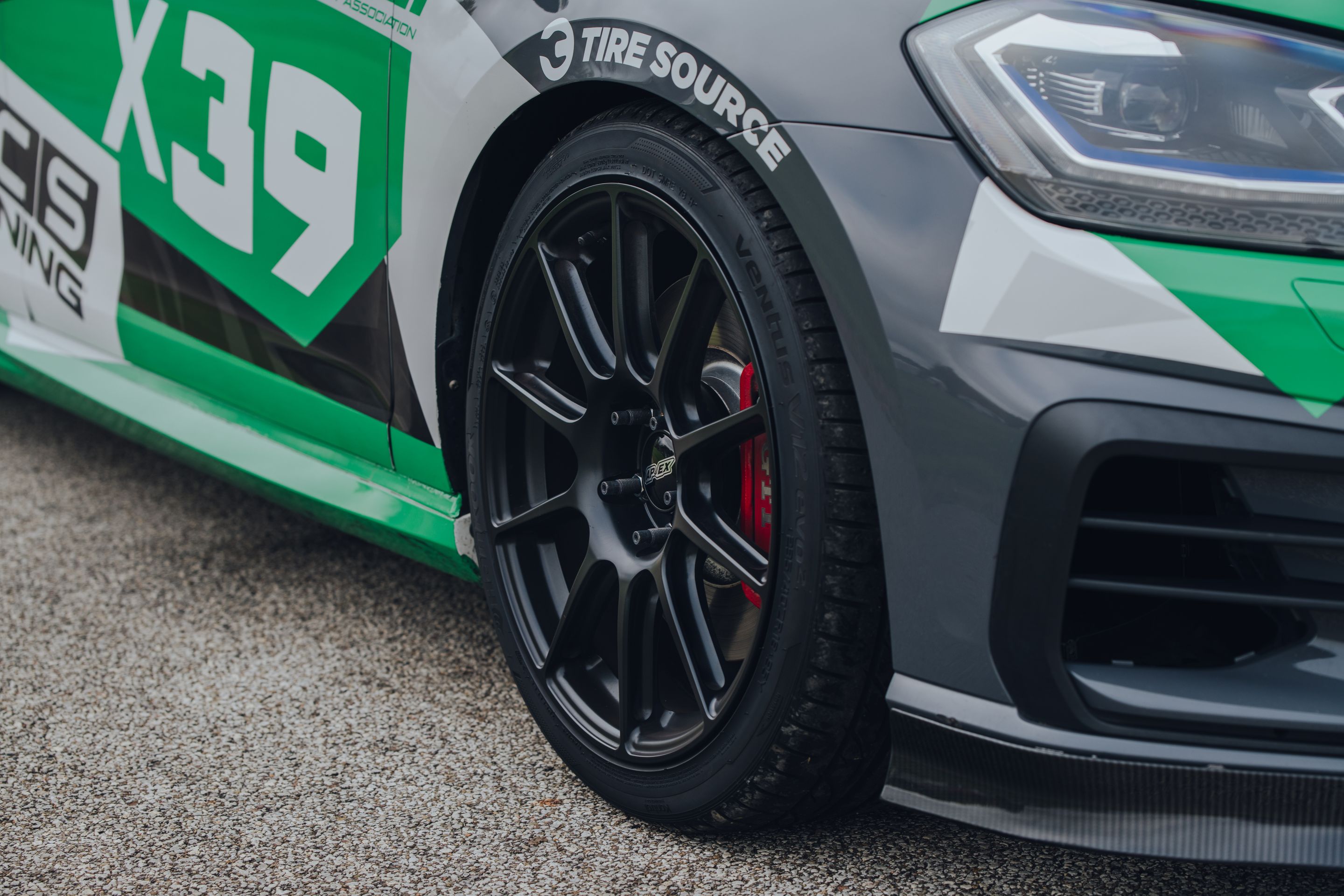 Race Livery VW MK7 GTI with 18" SM-10 Apex wheels in Satin Black