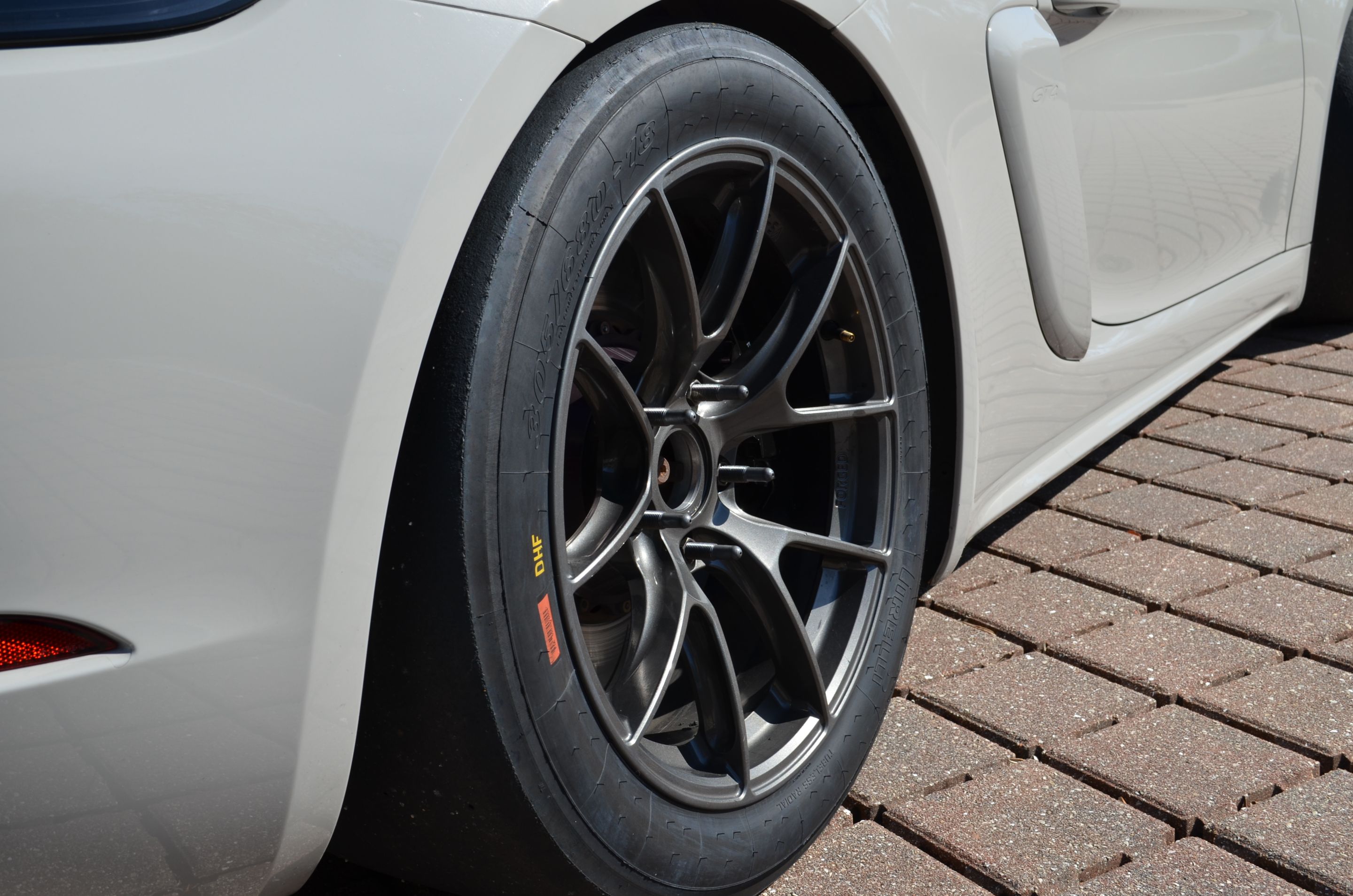 Grey Porsche 718 Cayman GT4 with 18" VS-5RS Apex wheels in Anthracite