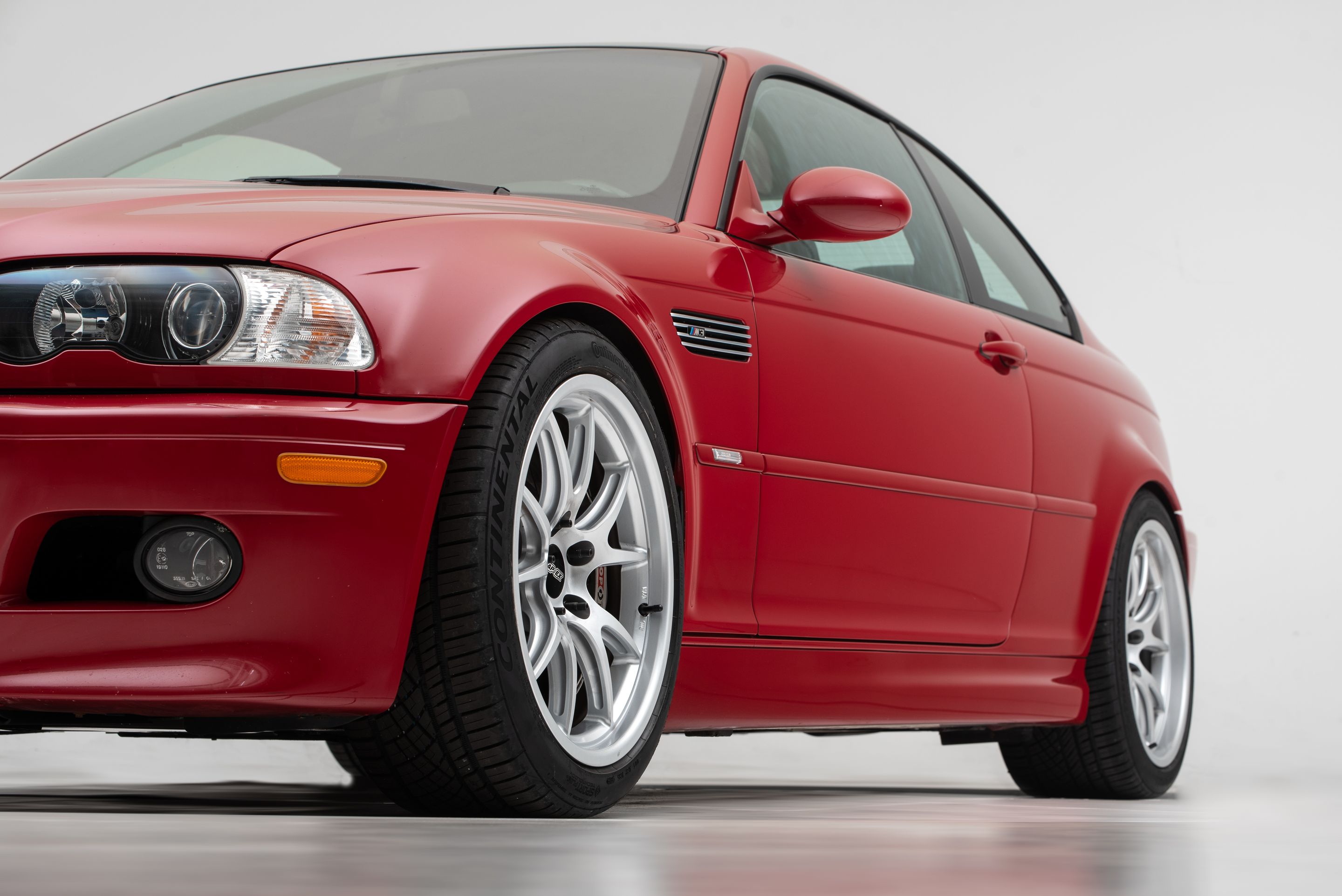 Red BMW E46 M3 with 18" FL-5 Apex wheels in Race Silver