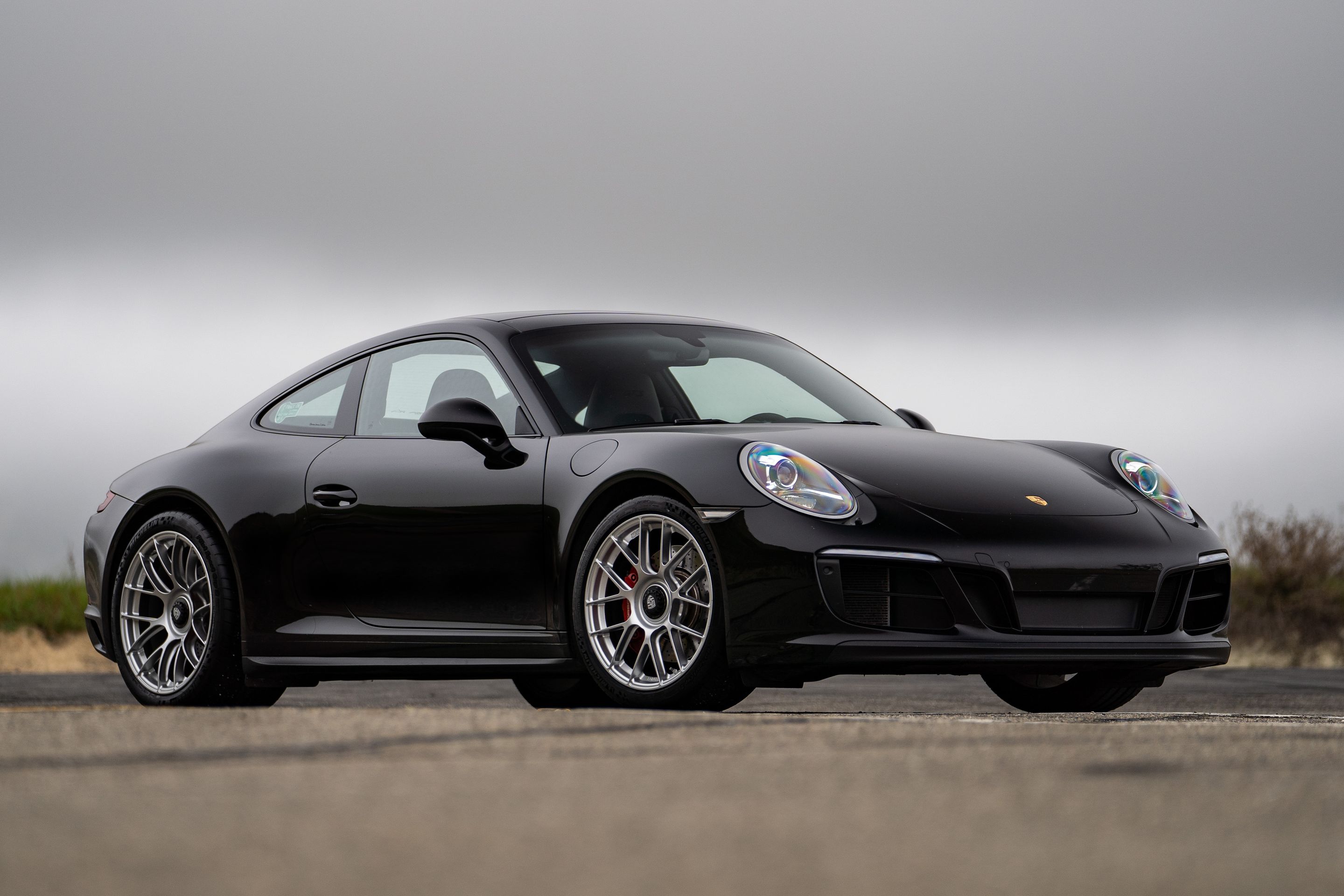 Black Porsche 911 991.2 Carrera GTS with 19" EC-7RS Apex wheels in Race Silver