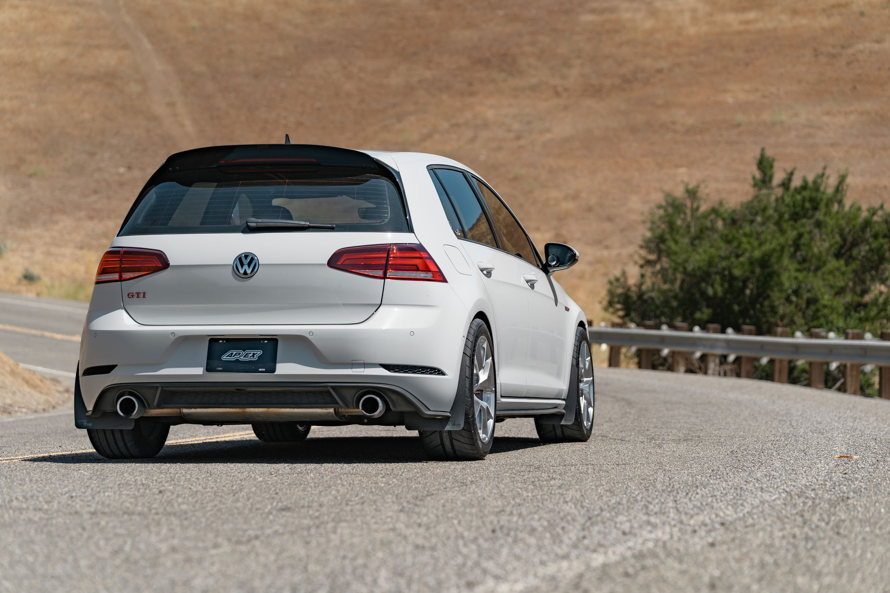 White VW MK7 GTI with 17" VS-5RS Apex wheels in Brushed Clear