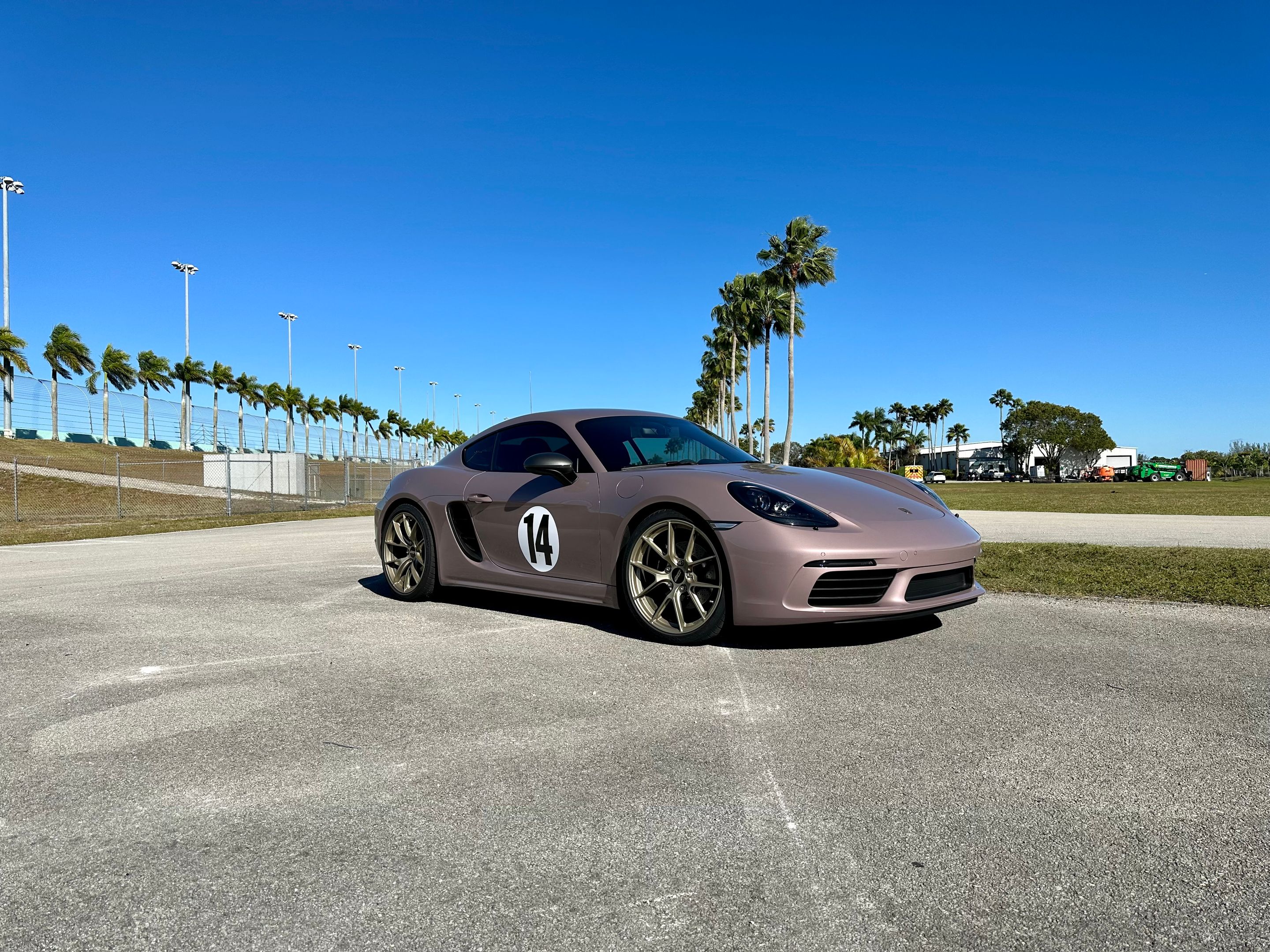 Pink Porsche 718 Cayman T with 20" VS-5RS Apex wheels in Motorsport Gold