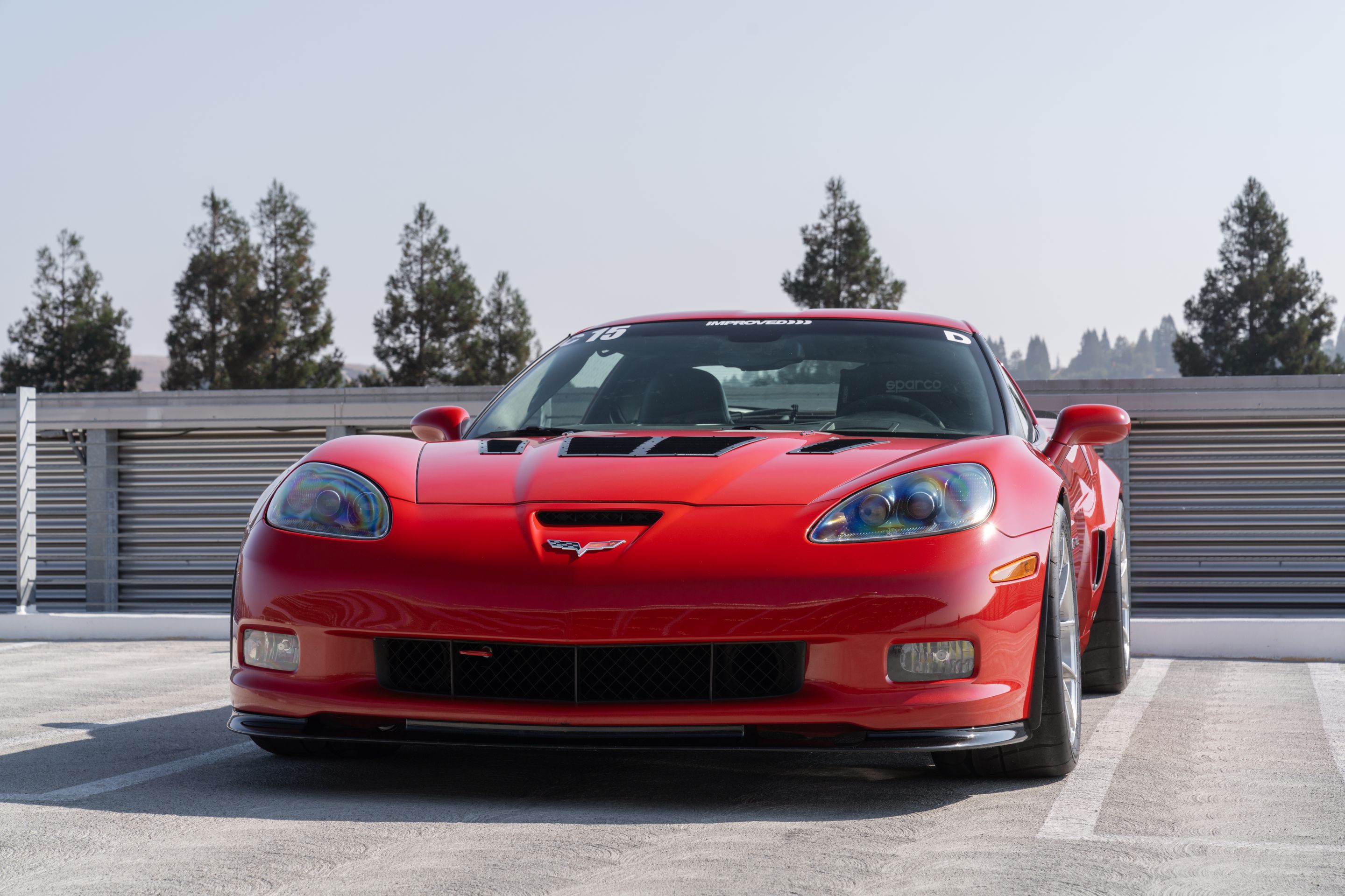 Red Chevrolet C6 Corvette Z06 with 18" VS-5RS Apex wheels in Brushed Clear