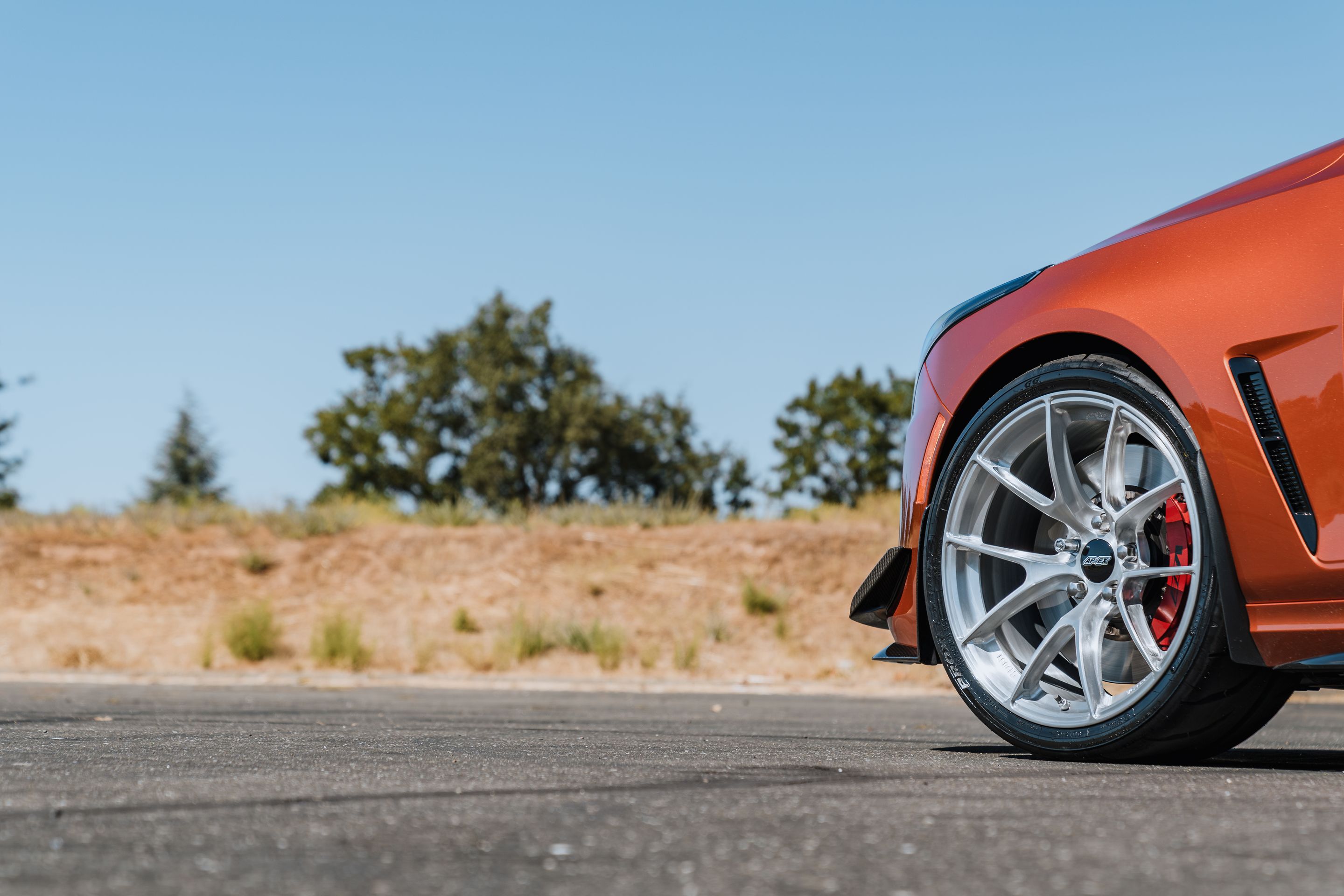 Orange Cadillac CT4-V Blackwing with 19" VS-5RS Apex wheels in Brushed Clear