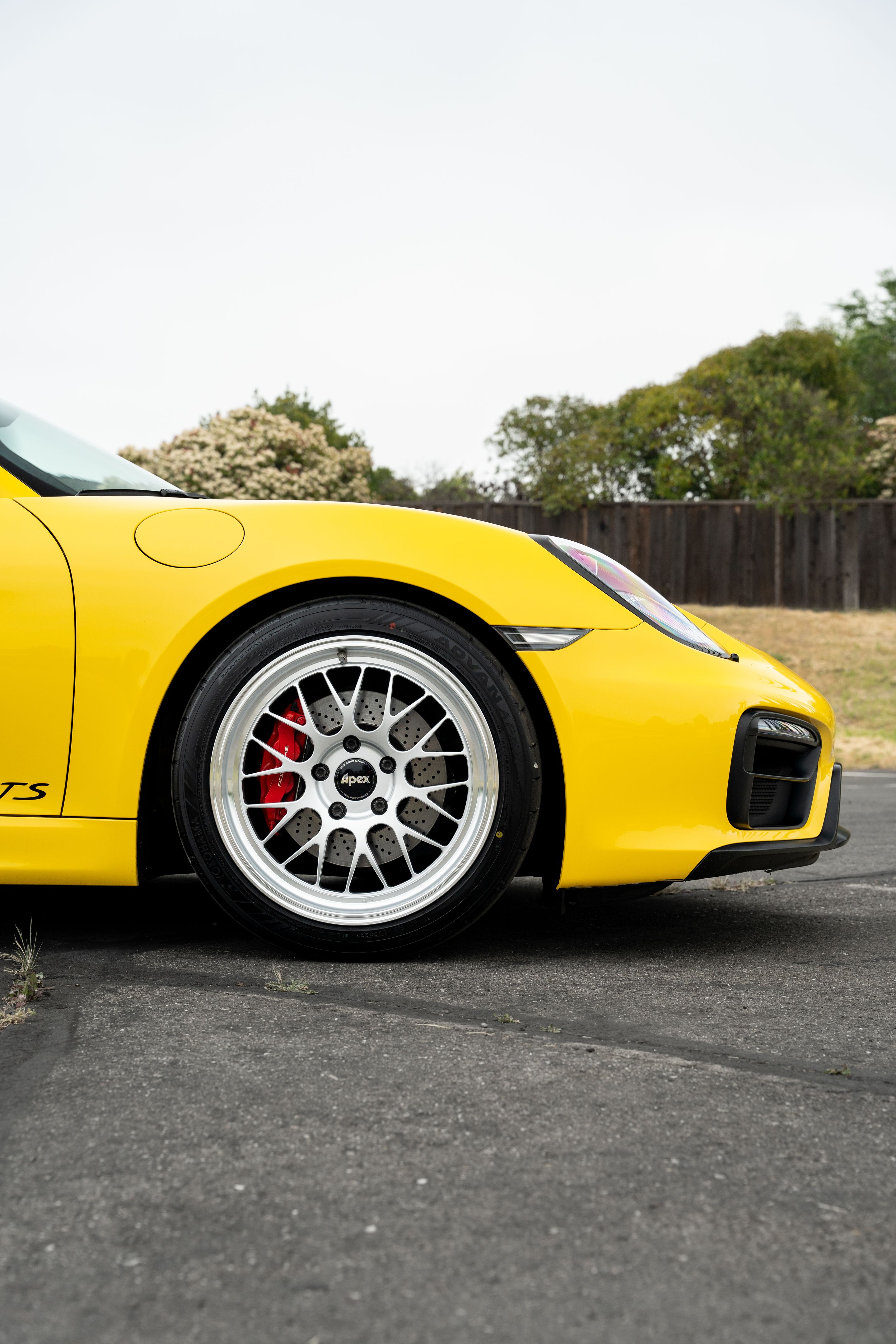 Yellow Porsche 981 Cayman GTS with 19" ML-10RT Apex wheels in Machined Lip Race Silver