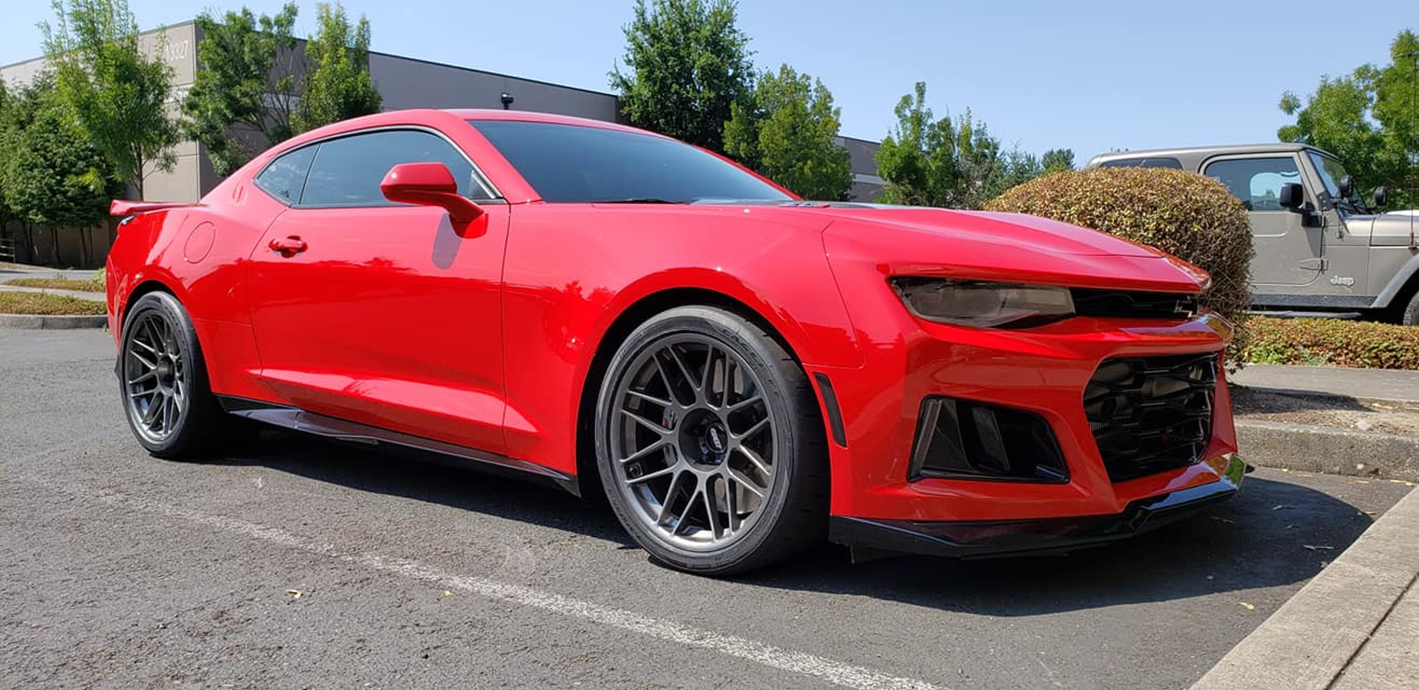 Red Chevrolet 6th Gen Camaro ZL1 with 19" ARC-8 Apex wheels in Anthracite