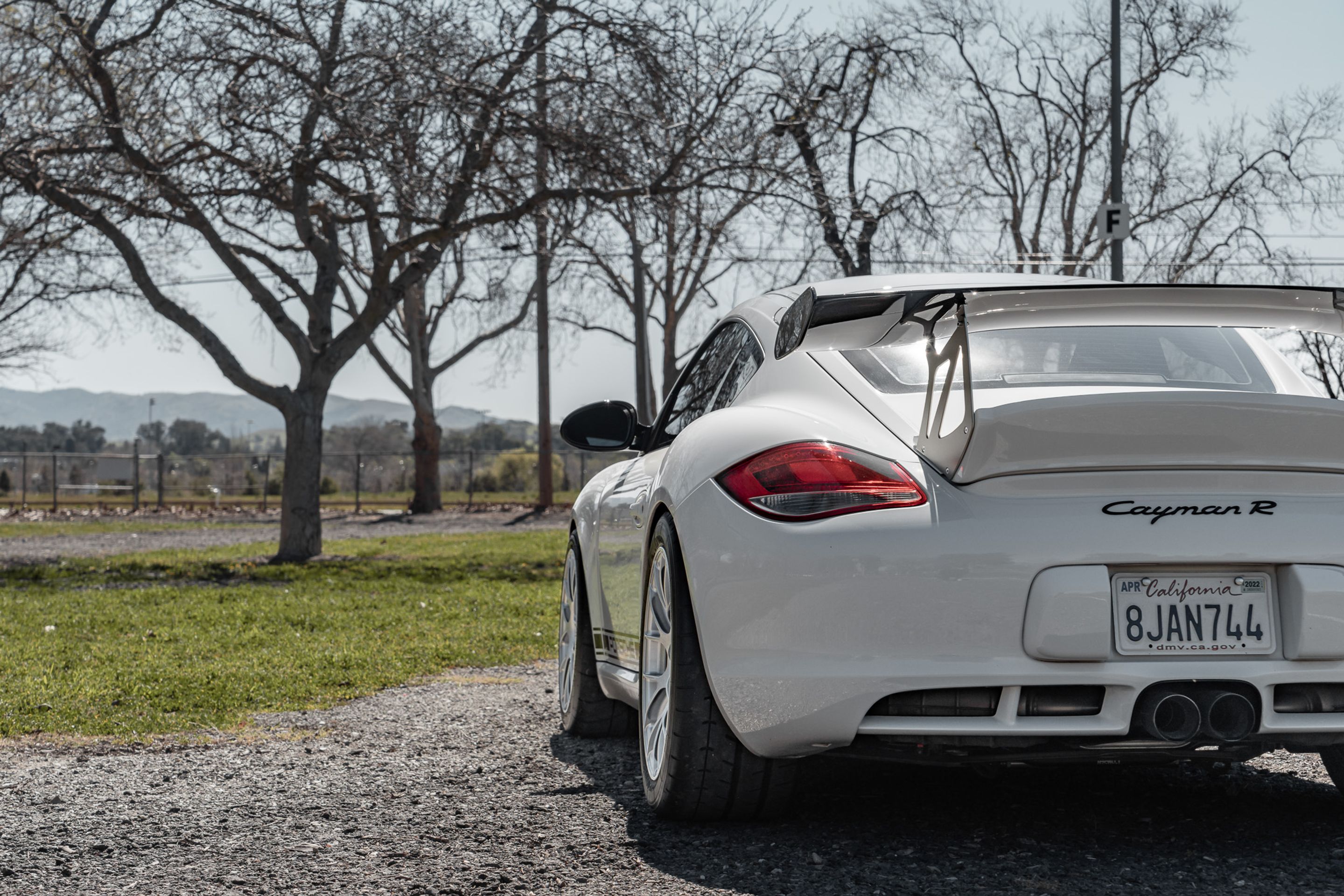 White Porsche 987 Cayman R with 18" EC-7RS Apex wheels in Race Silver