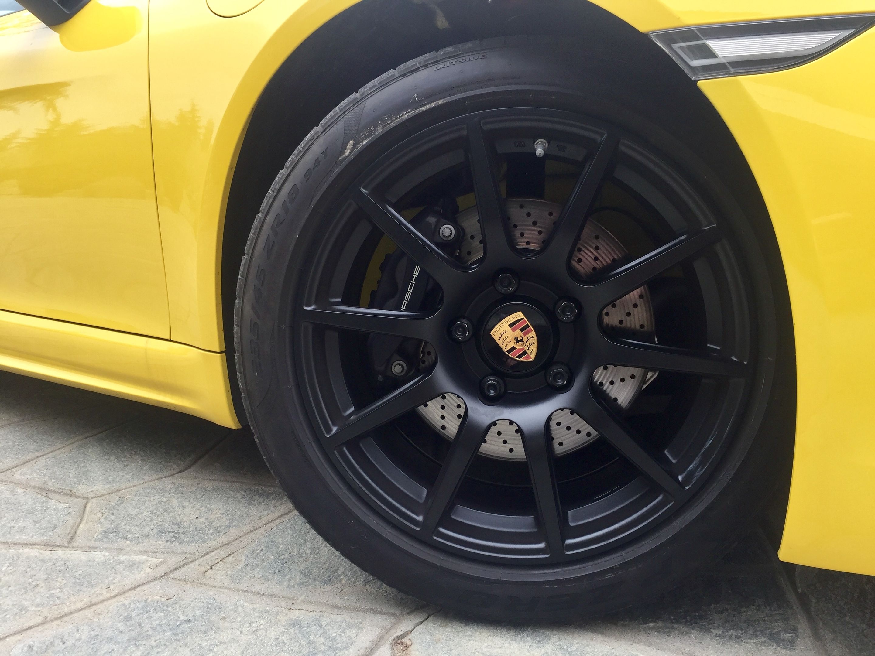 Yellow Porsche 718 Cayman Base with 18" SM-10 Apex wheels in Satin Black