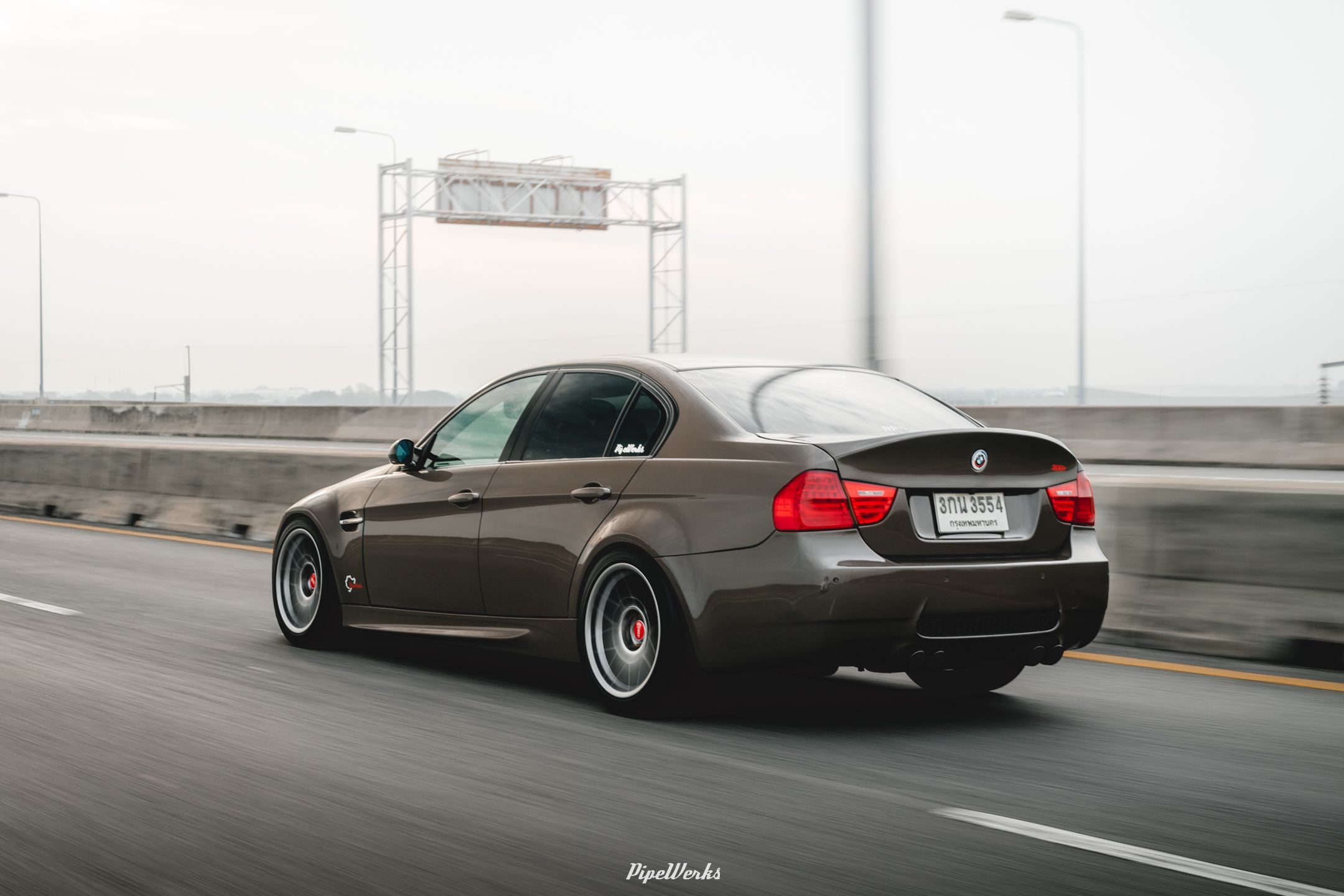 Brown BMW E90 Sedan 3 Series with 18" ARC-8 Apex wheels in Hyper Black