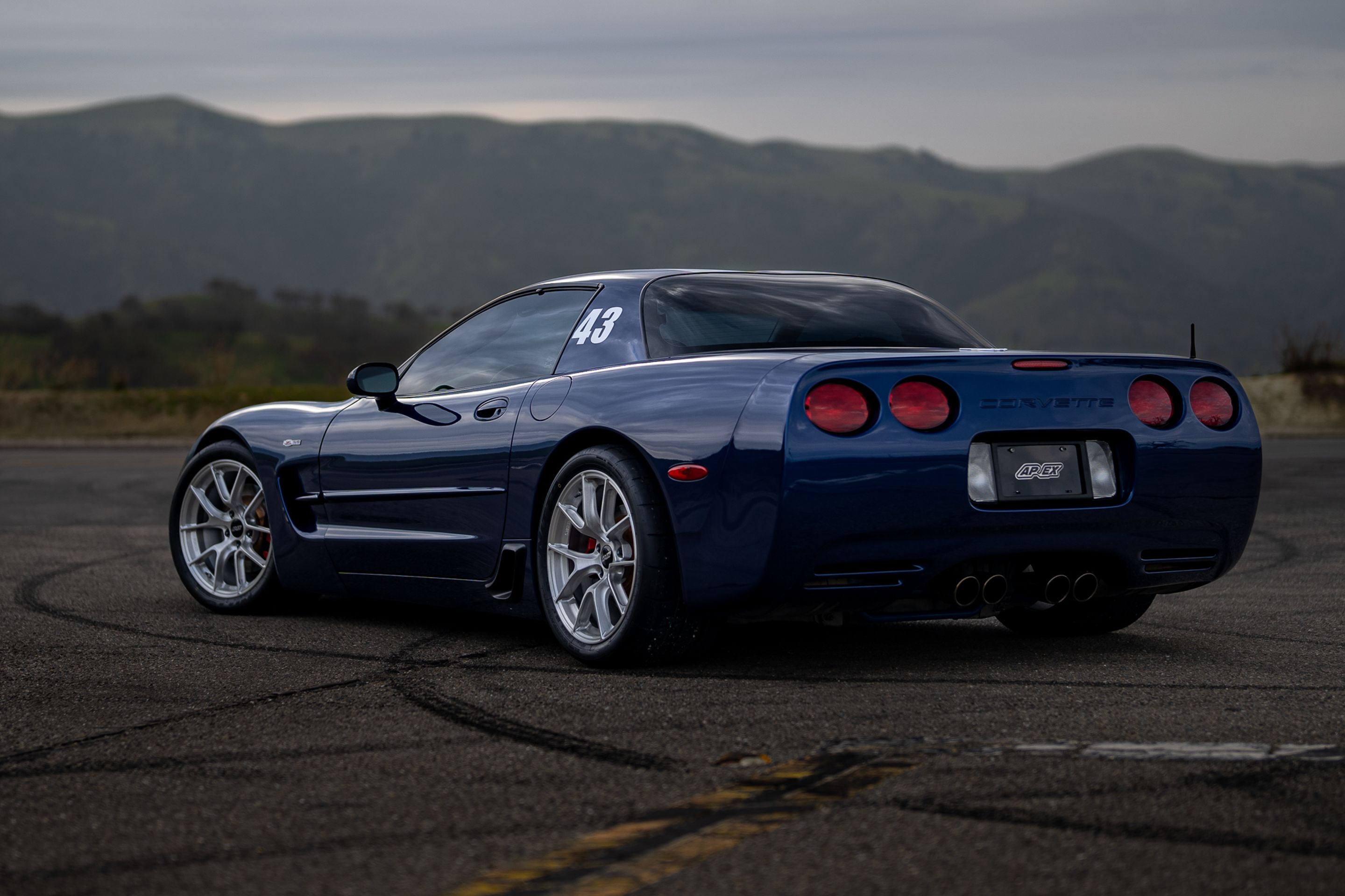 Blue Chevrolet C5 Corvette Z06 with 18" VS-5RS Apex wheels in Brushed Clear