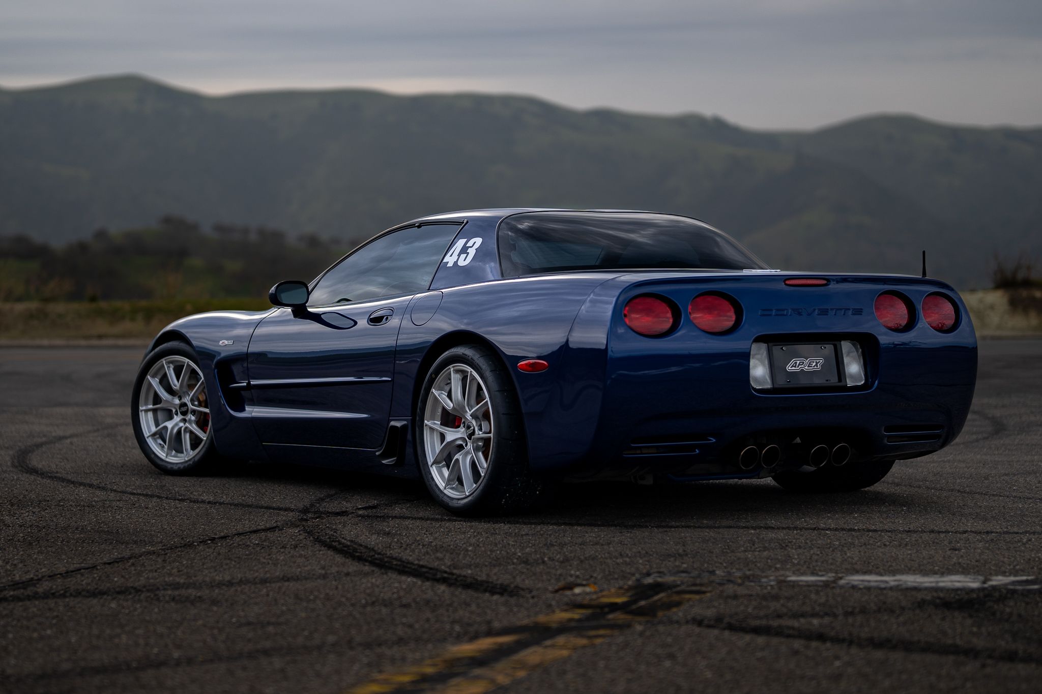 Blue Chevrolet C5 Corvette Z06 with 18" VS-5RS Apex wheels in Brushed Clear