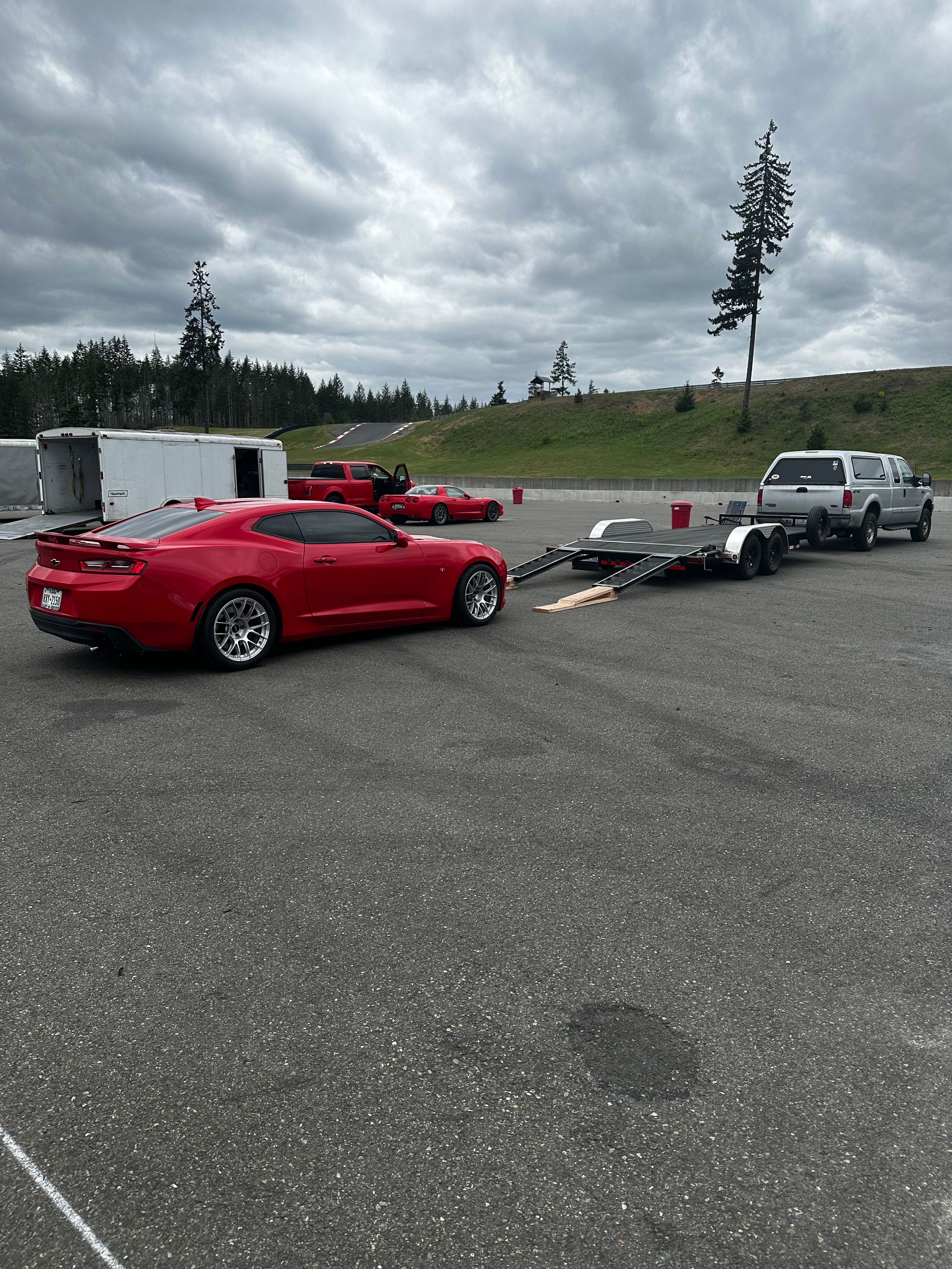 Red Chevrolet 6th Gen Camaro SS with 18" EC-7RS Apex wheels in Brushed Clear