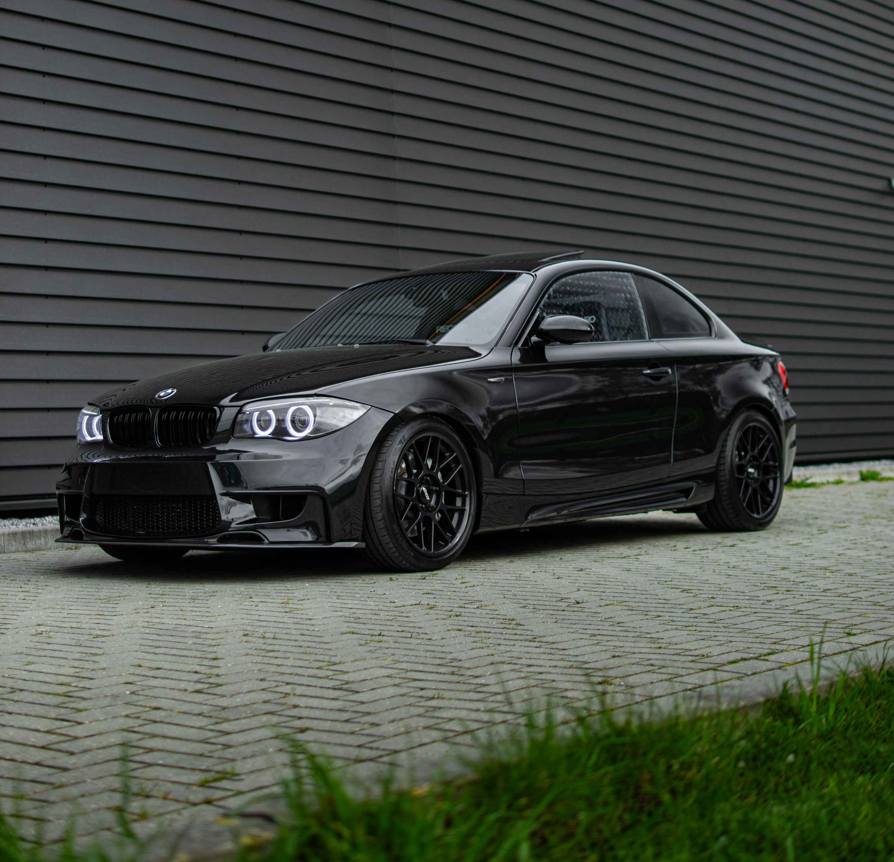 Black BMW E82 Coupe 1 Series with 18" ARC-8 Apex wheels in Satin Black