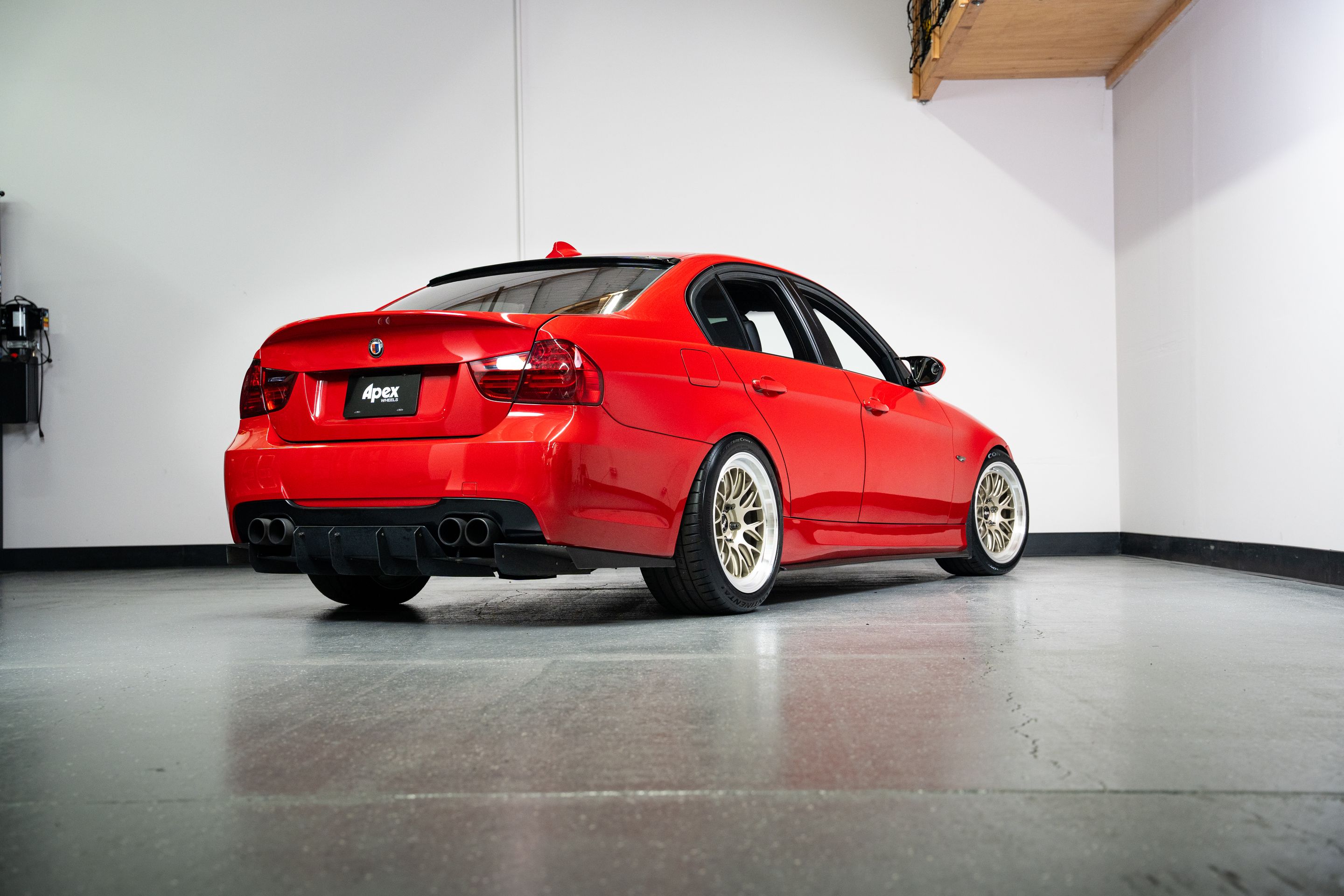 Red BMW E90 Sedan 3 Series with 18" ML-10RT Apex wheels in Machined Lip Gloss Motorsport Gold