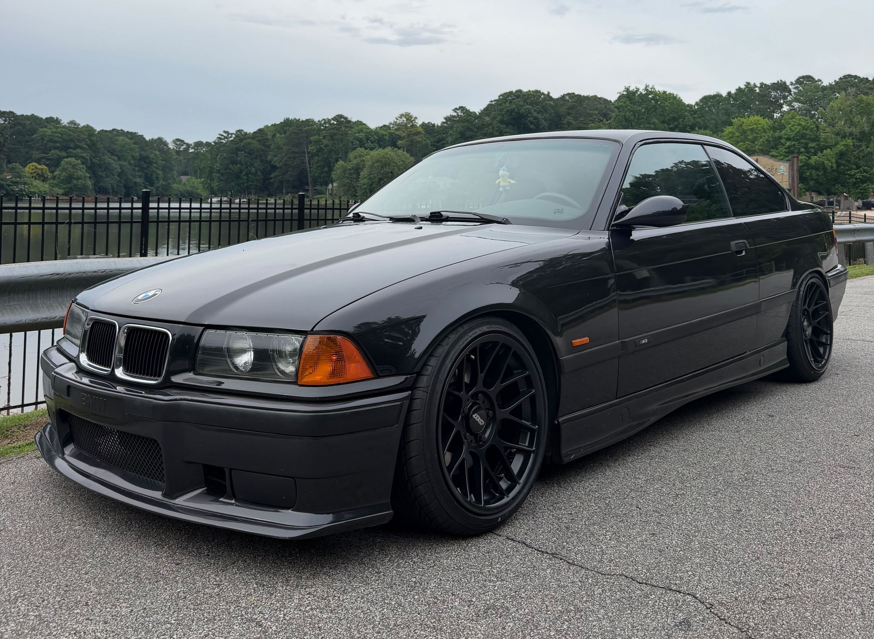 Black BMW E36 M3 with 17" ARC-8 Apex wheels in Satin Black