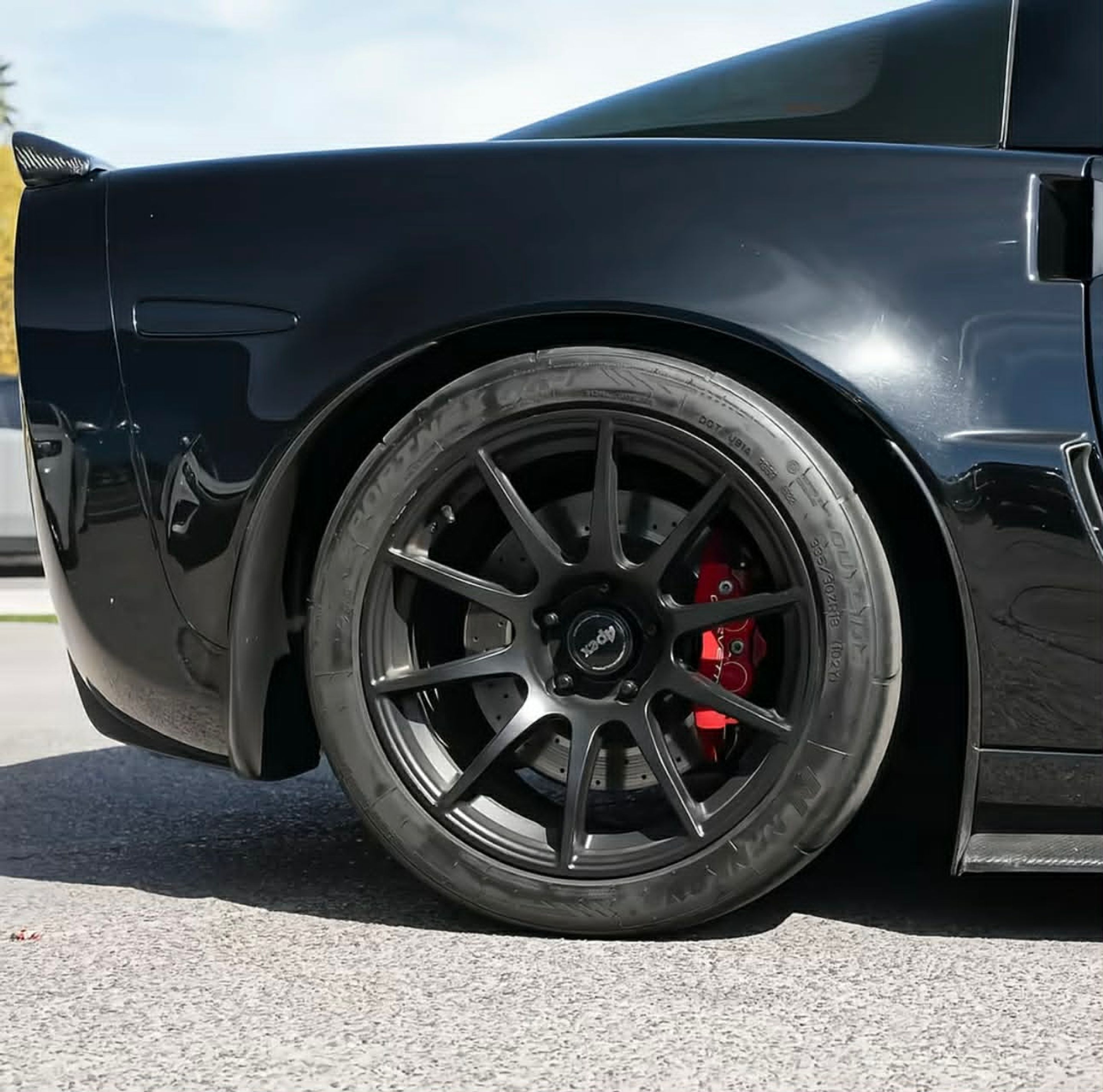 Black Chevrolet C6 Corvette Z06 with 18" SM-10 Apex wheels in Satin Black