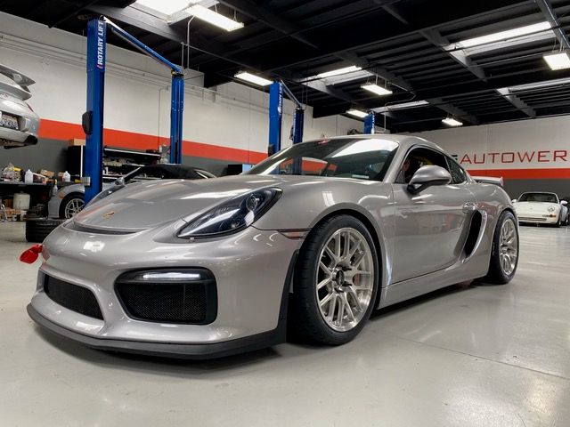 Silver Porsche 981 Cayman GT4 with 18" EC-7R Apex wheels in Brushed Clear