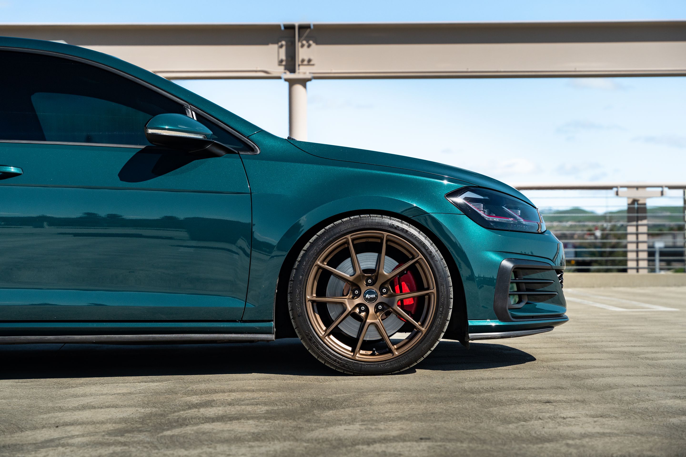 Green VW MK7 GTI with 18" VS-5 Apex wheels in Satin Bronze