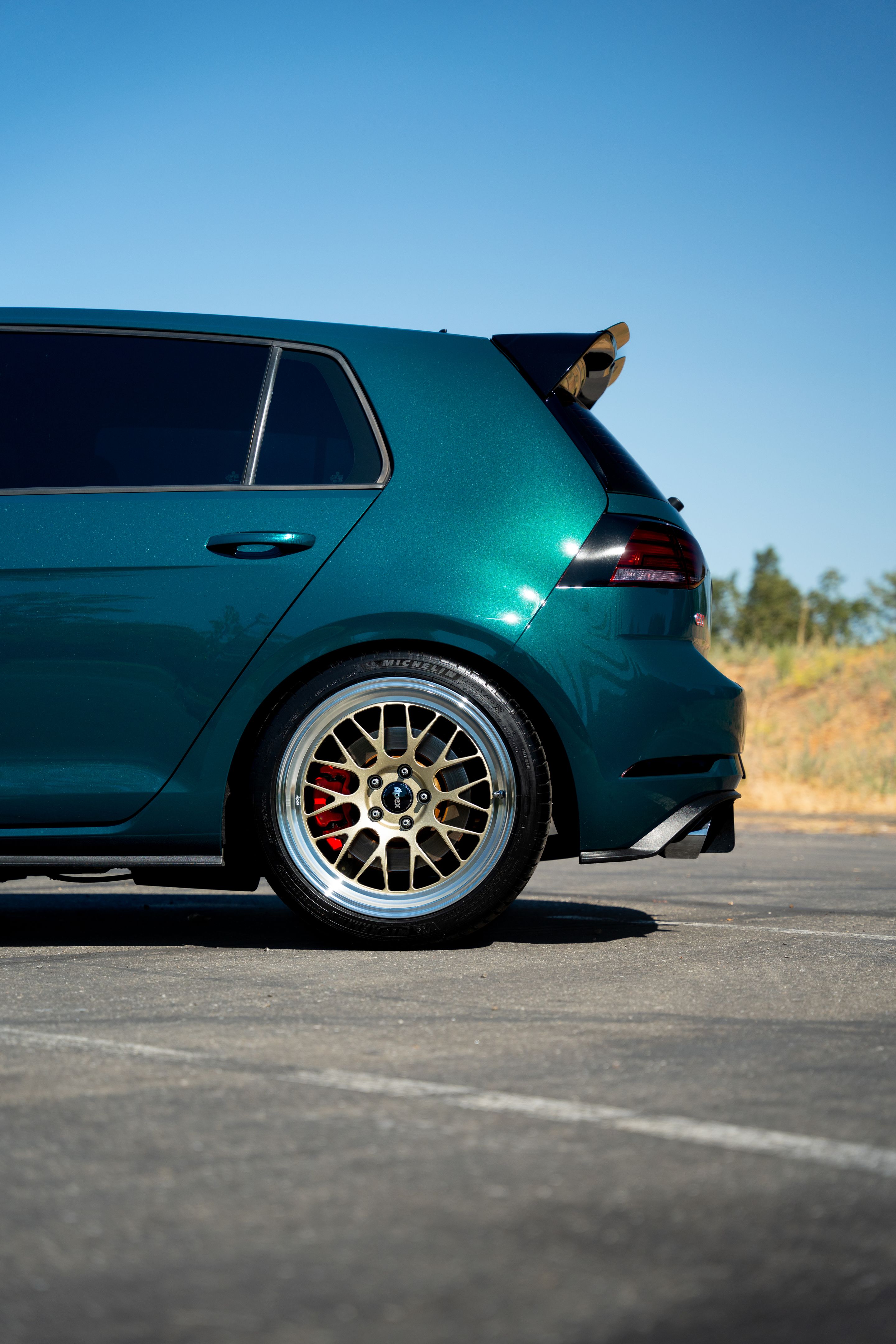 Green VW MK7 GTI with 18" ML-10RT Apex wheels in Machined Lip Gloss Motorsport Gold