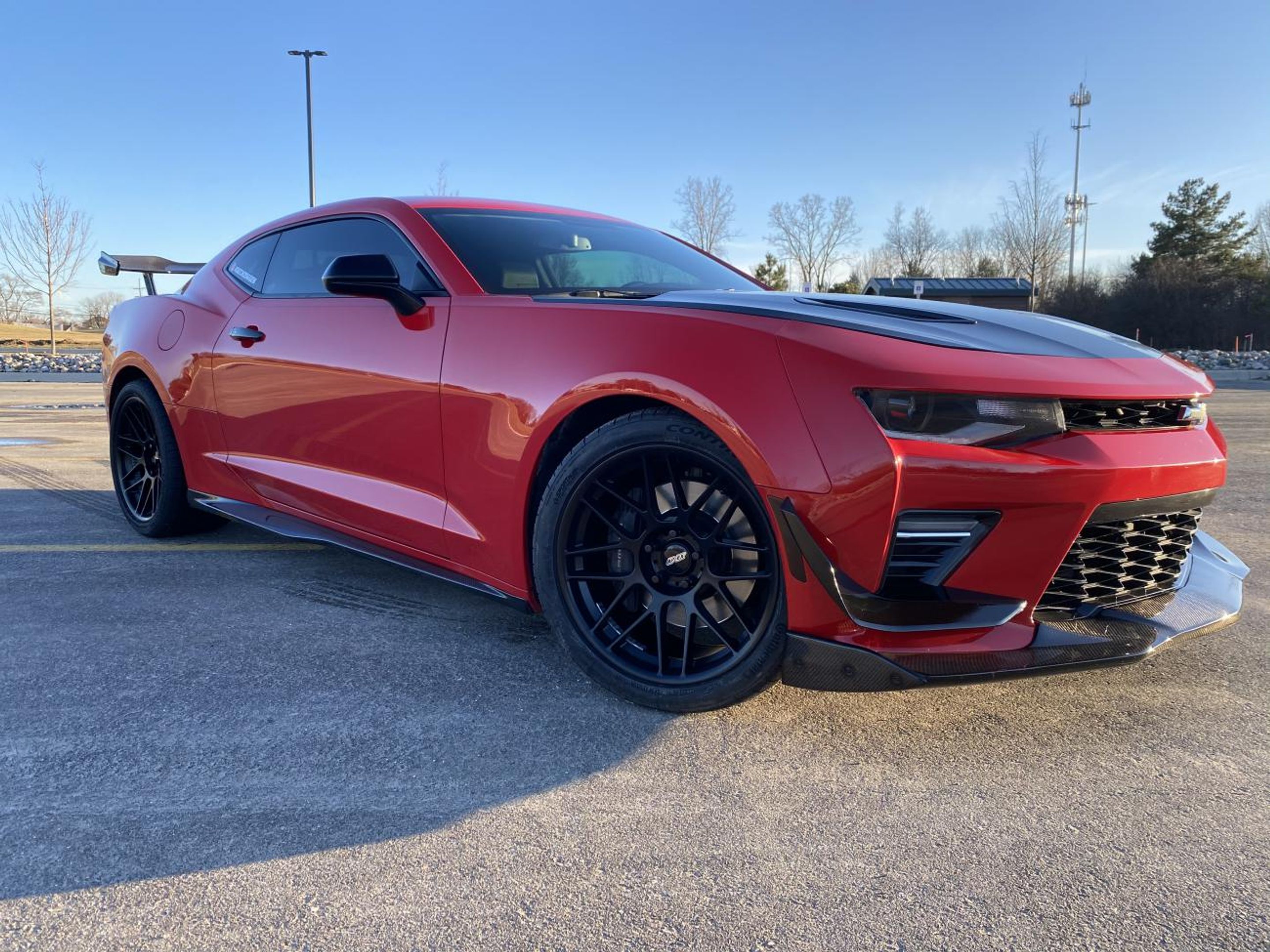 Red Chevrolet 6th Gen Camaro SS 1LE with 19" ARC-8 Apex wheels in Satin Black