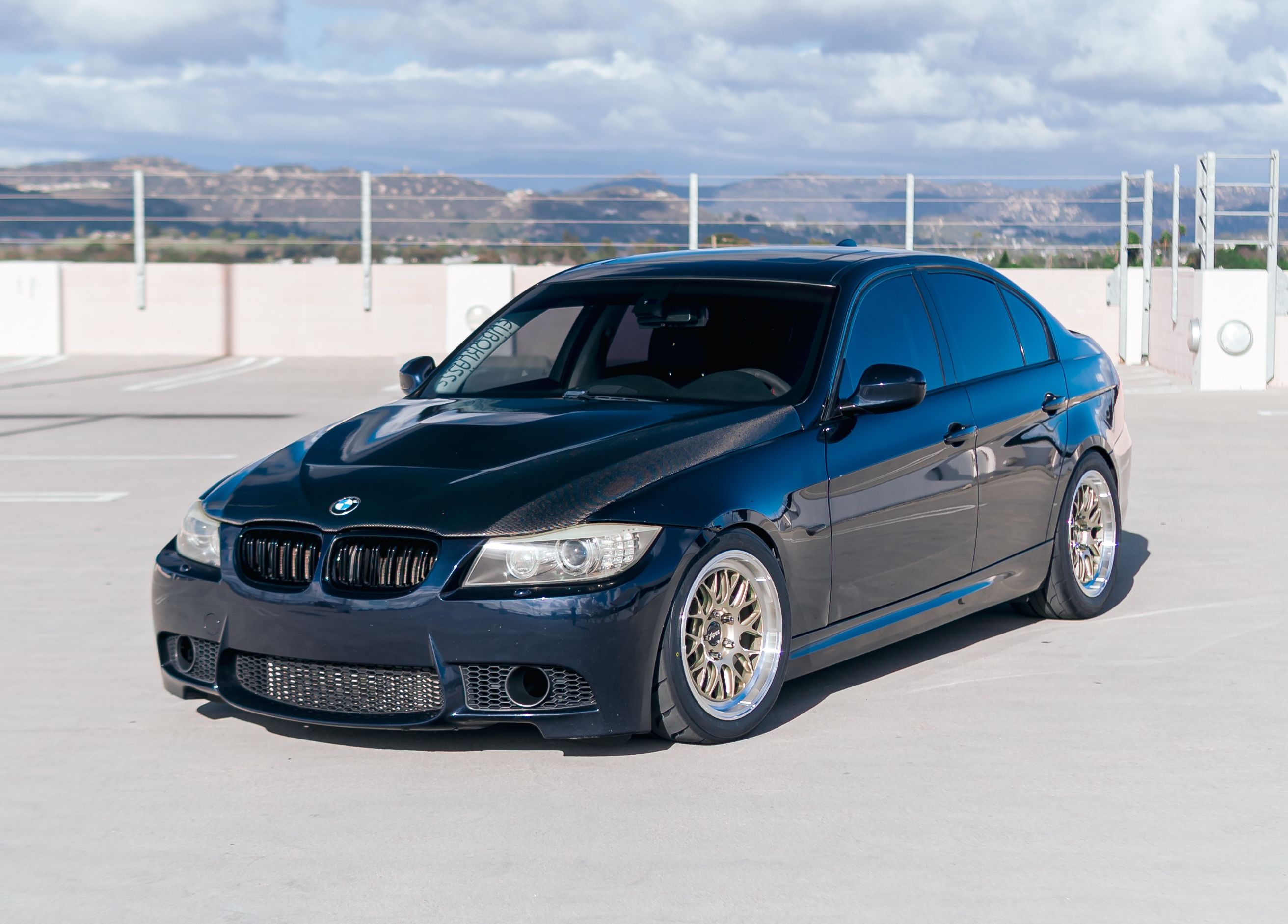 Black BMW E90 Sedan 3 Series with 17" ML-10RT Apex wheels in Machined Lip Gloss Motorsport Gold