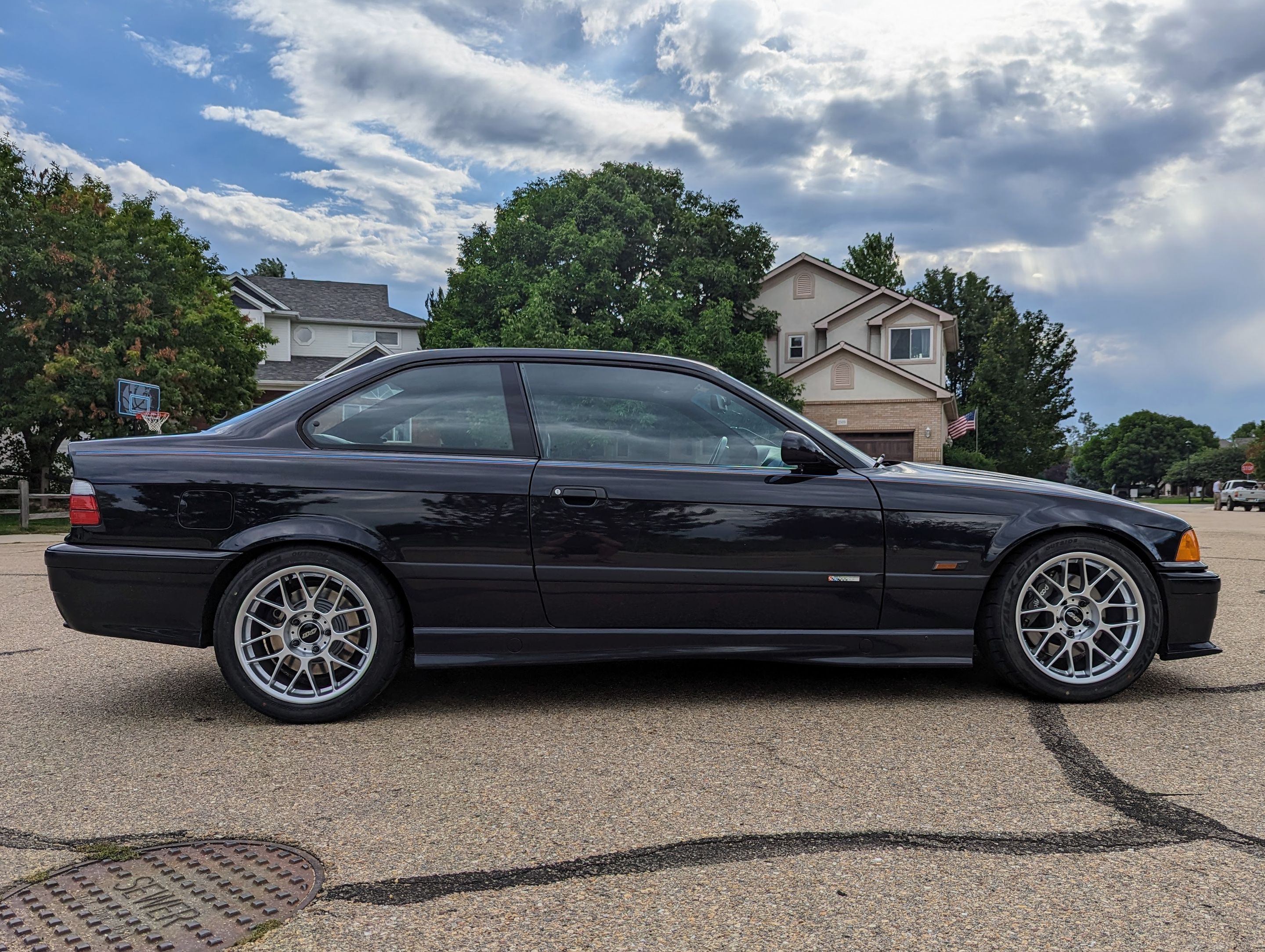Black BMW E36 M3 with 17" ARC-8 Apex wheels in Hyper Silver