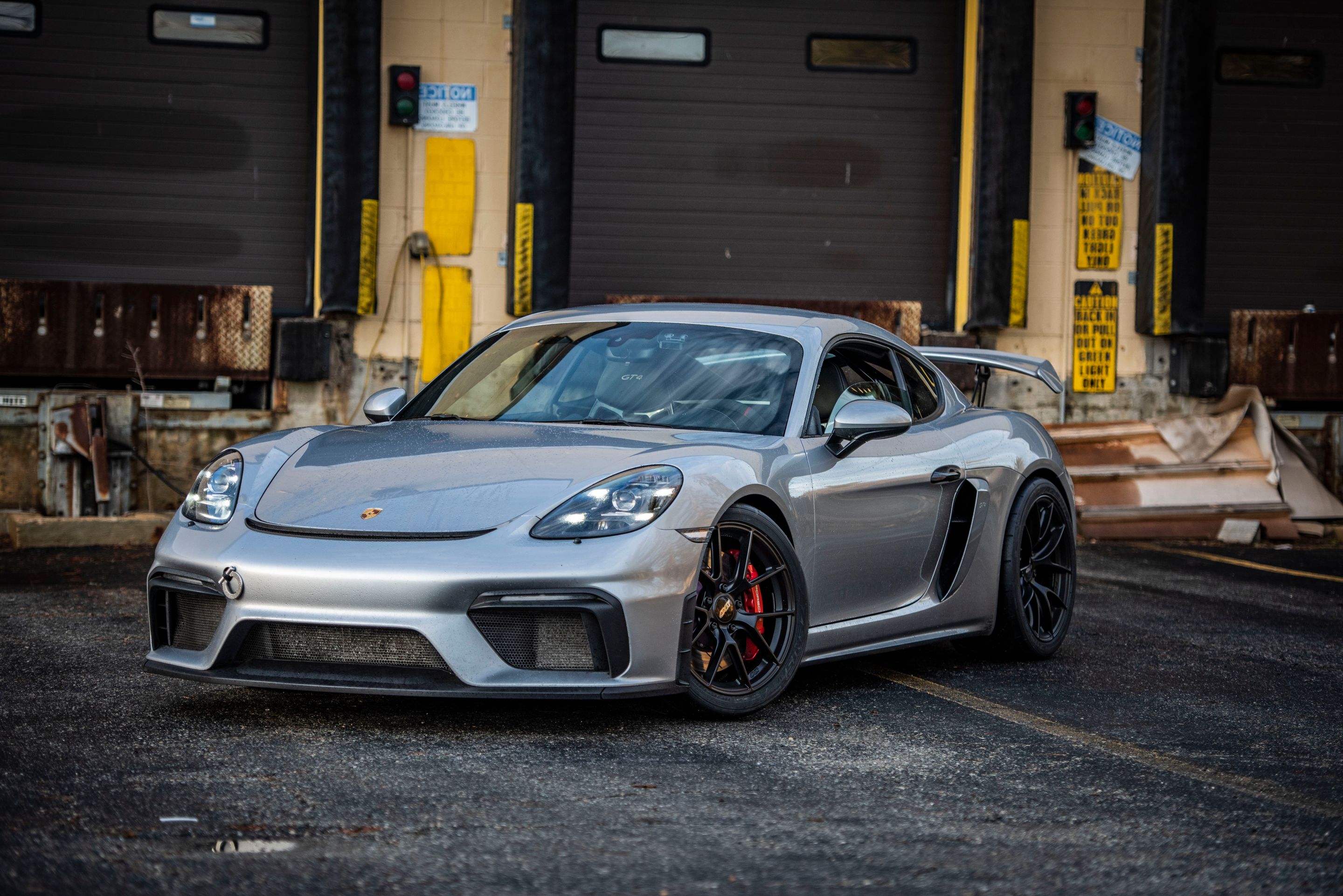 Silver Porsche 718 Cayman GT4 with 19" VS-5RS Apex wheels in Satin Black
