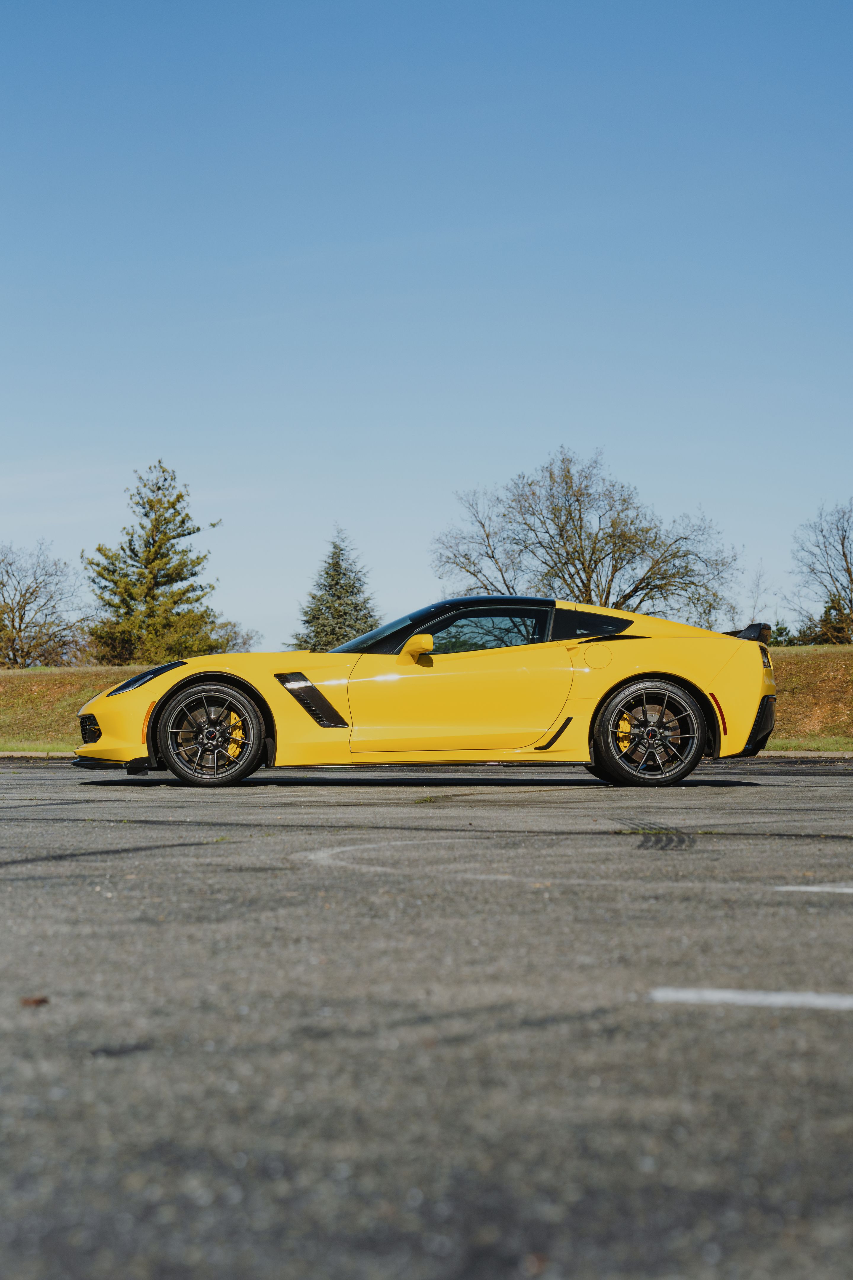 Yellow Chevrolet C7 Corvette Z06 with 19"/20" VS-5RS Apex wheels in Anthracite