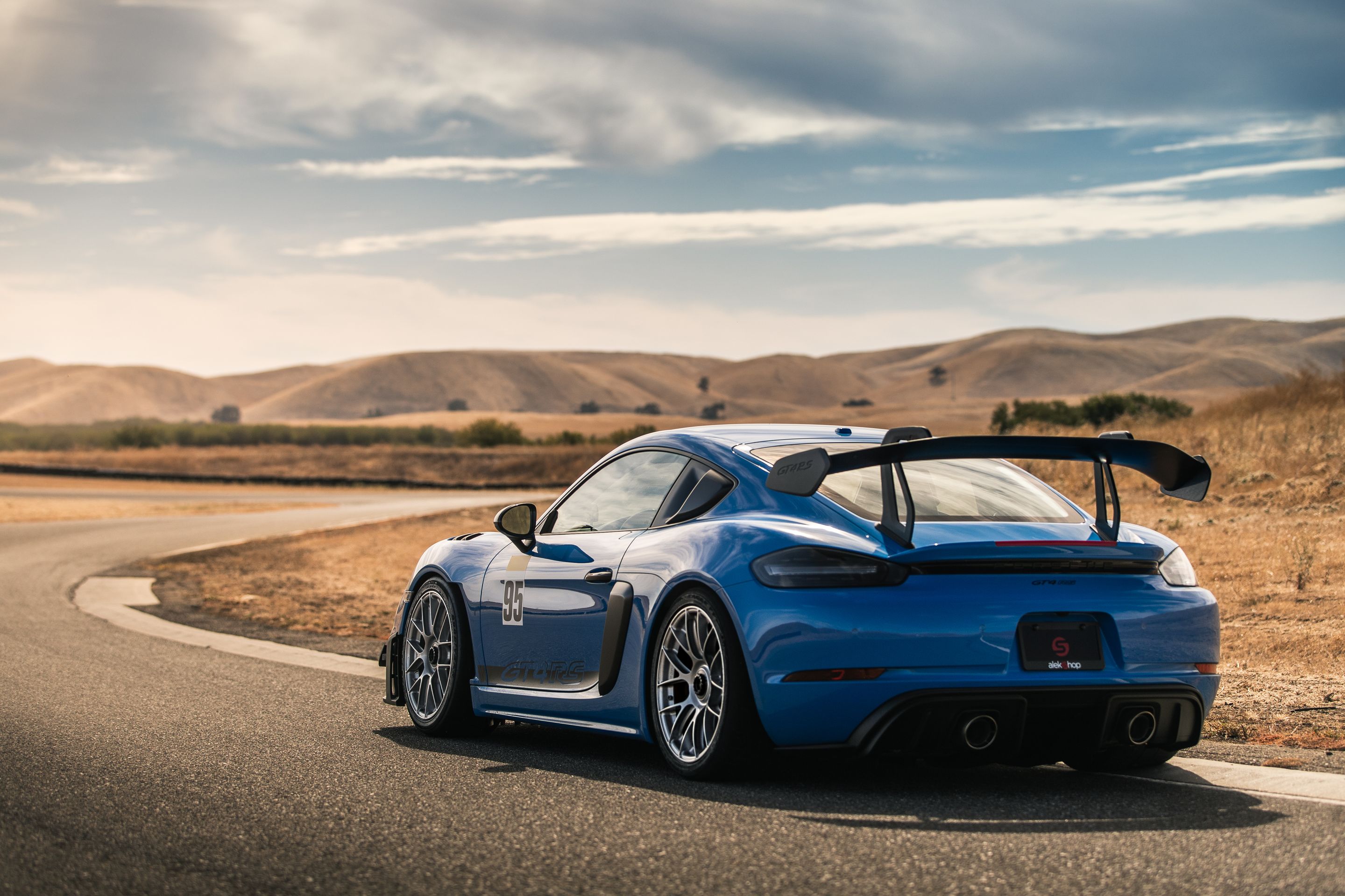 Blue Porsche 718 Cayman GT4 RS with 19" EC-7RS Apex wheels in Race Silver