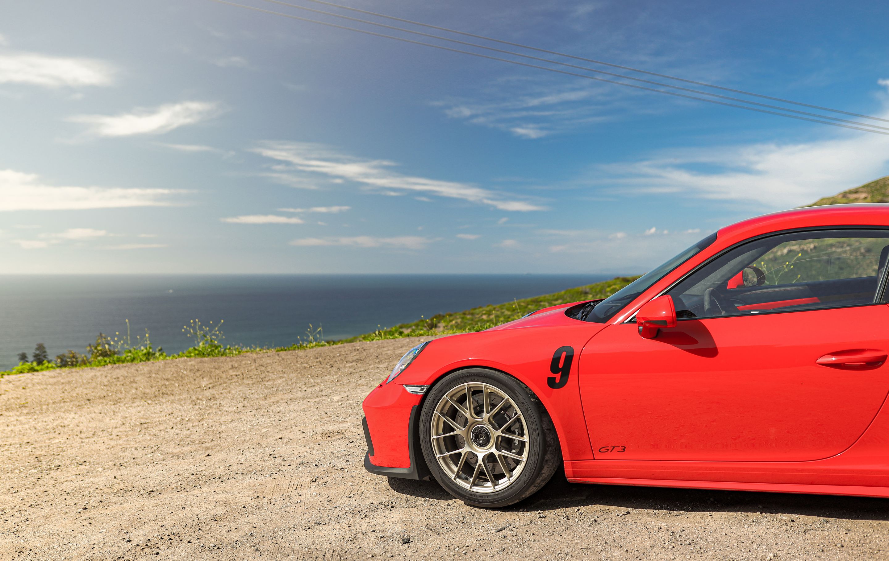Red Porsche 911 991.2 GT3 with 19" EC-7RS Apex wheels in Motorsport Gold