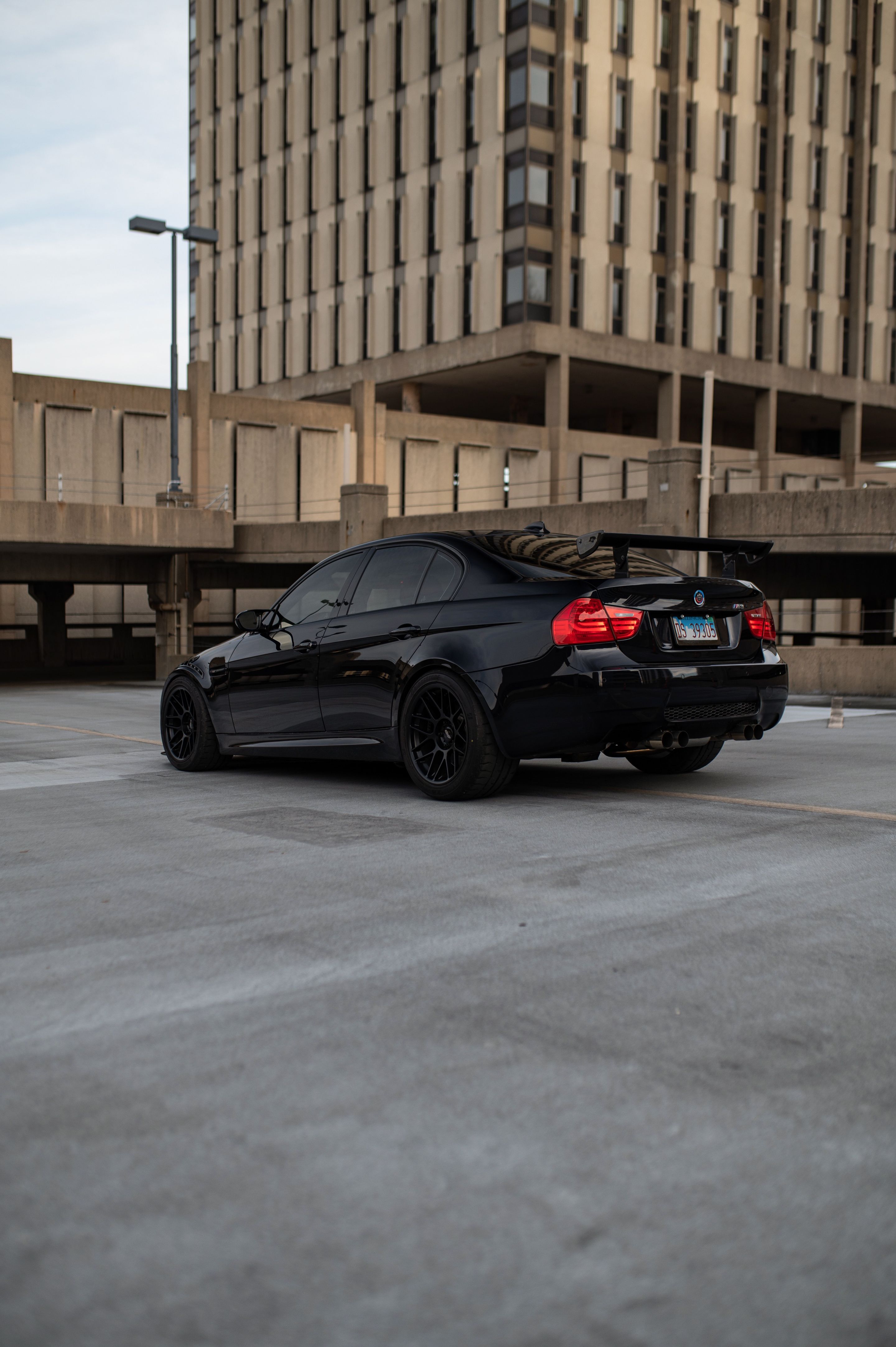 Black BMW E90 Sedan M3 with 18" ARC-8 Apex wheels in Satin Black