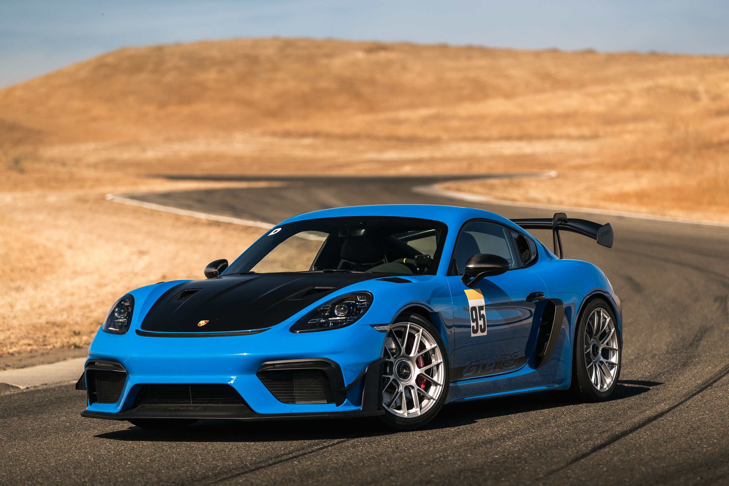 Blue Porsche 718 Cayman GT4 RS with 19" EC-7RS Apex wheels in Race Silver