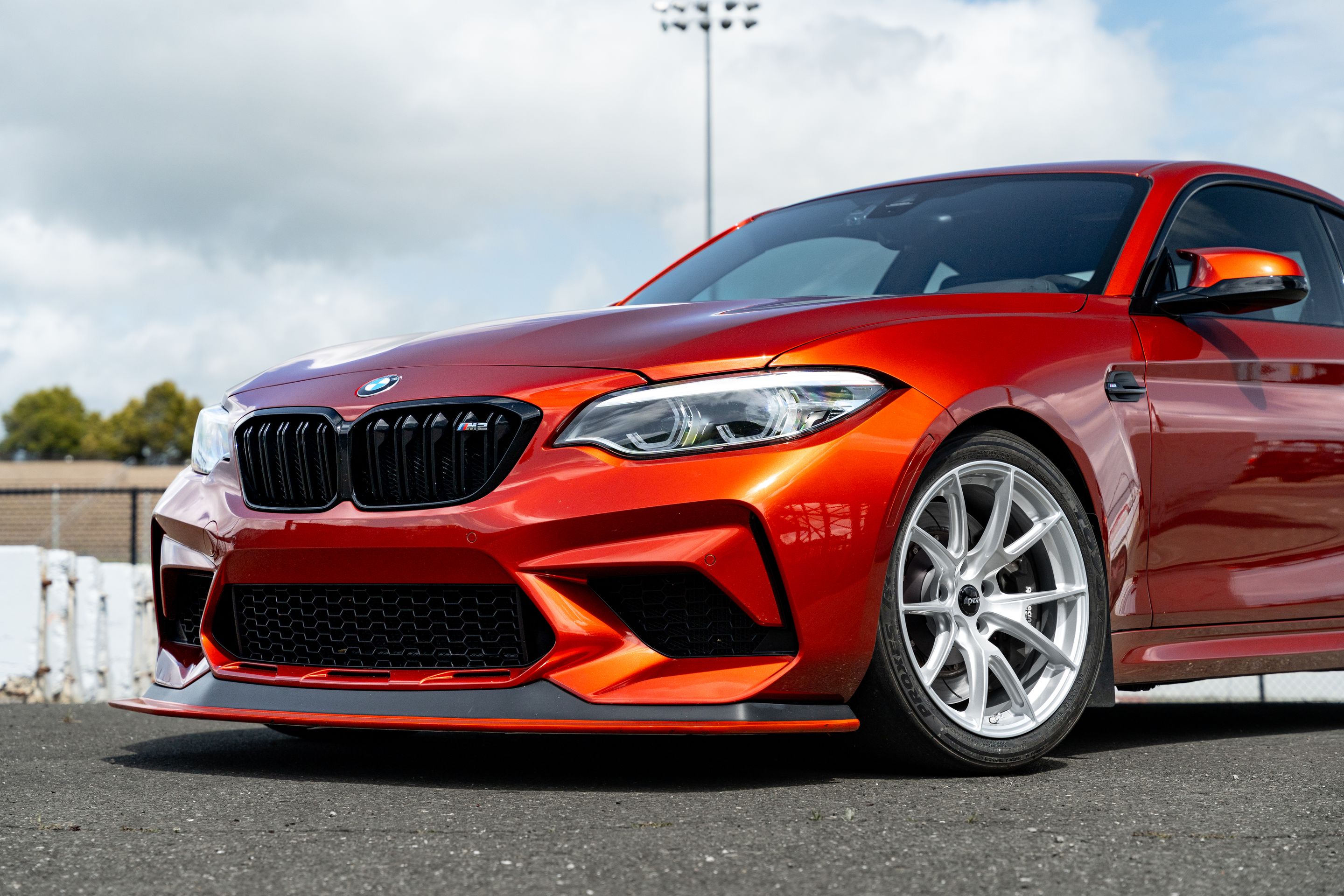 Orange BMW F87 M2 with 18" VS-5 Apex wheels in Race Silver