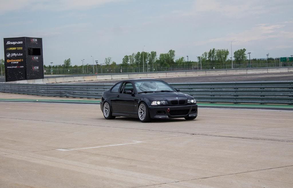 Black BMW E46 M3 with 18" ARC-8 Apex wheels in Hyper Silver
