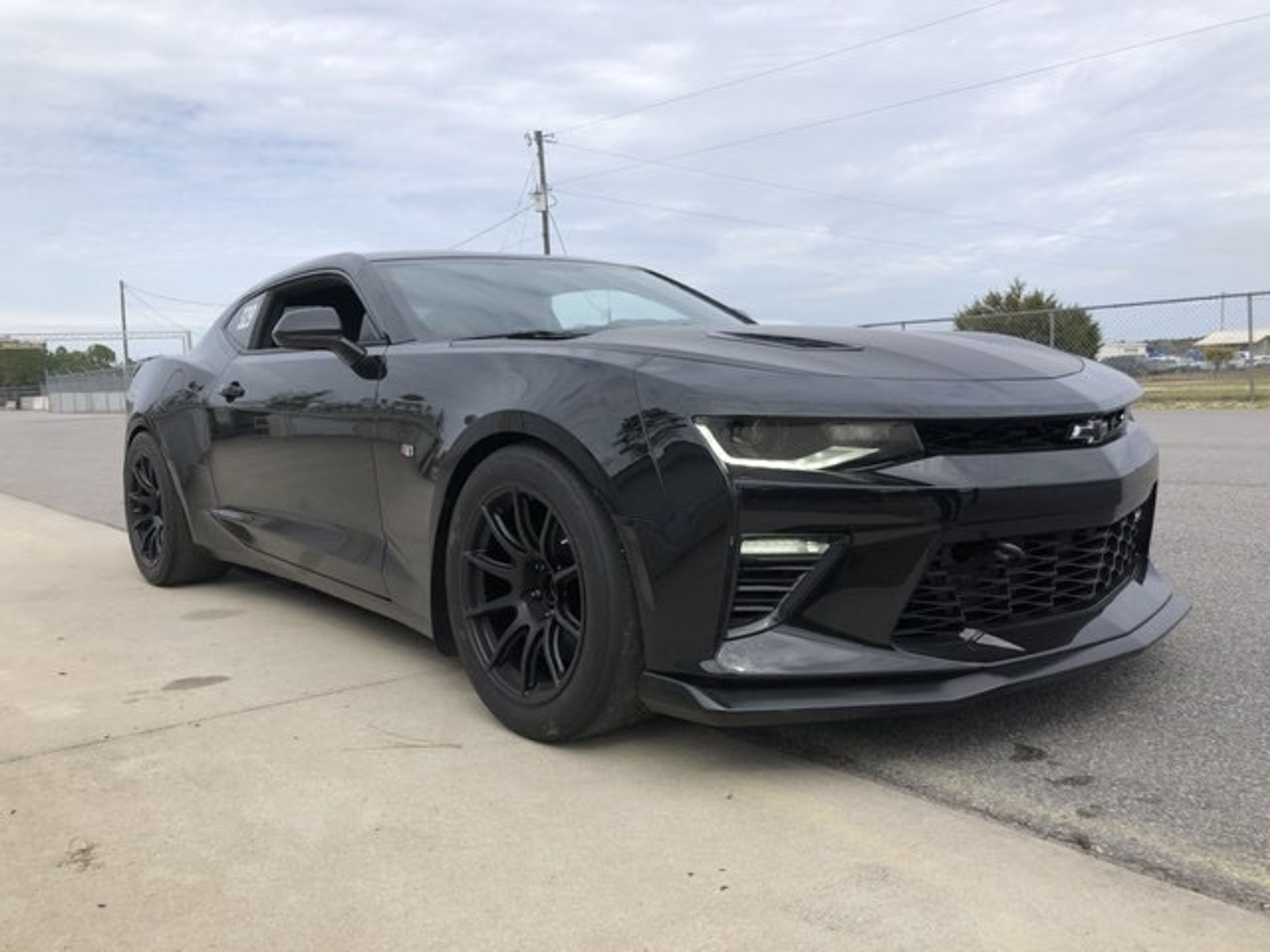 Black Chevrolet 6th Gen Camaro SS 1LE with 18" SM-10 Apex wheels in Satin Black