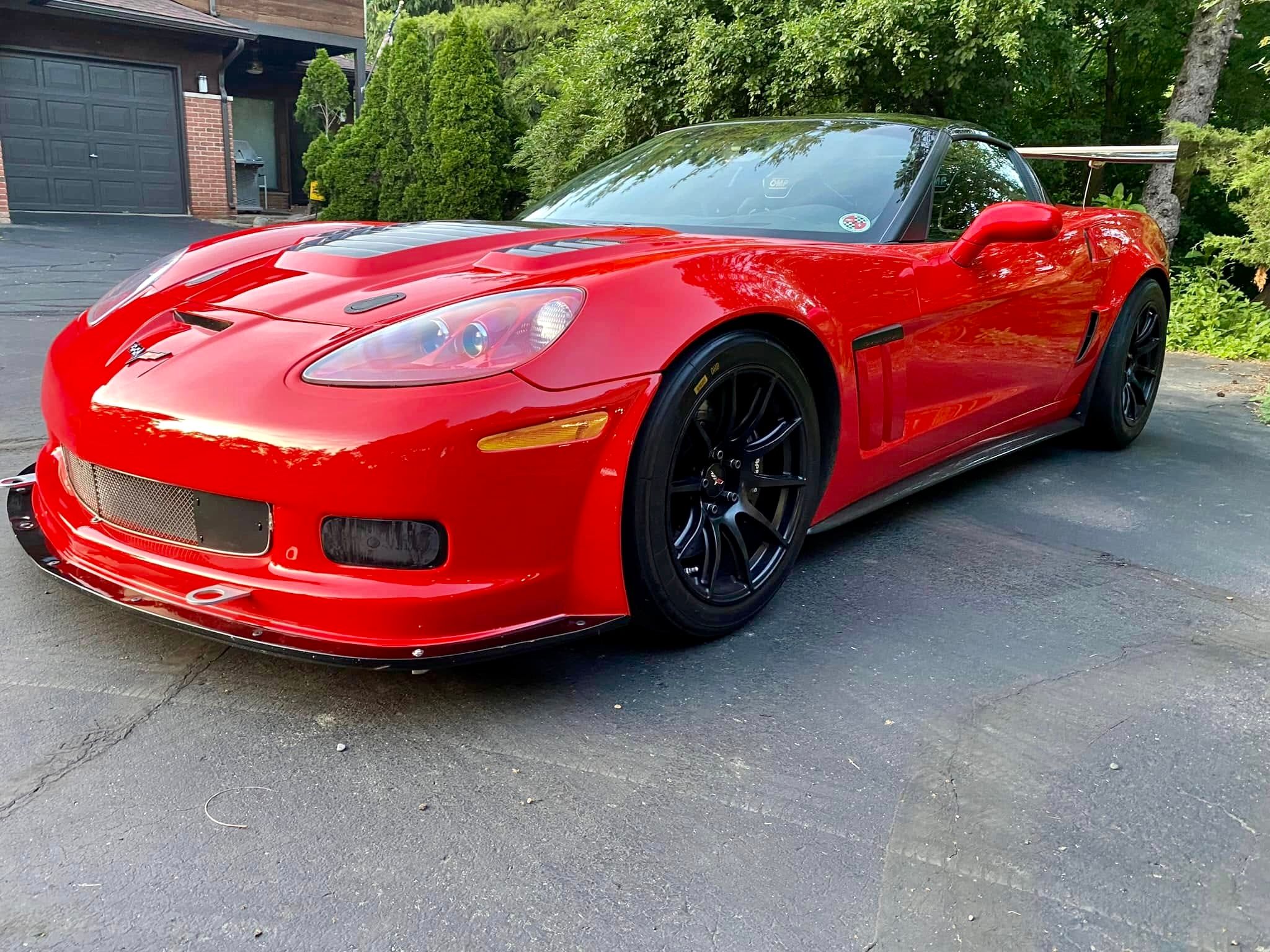 Red Chevrolet C6 Corvette Grand Sport with 18" SM-10 Apex wheels in Satin Black