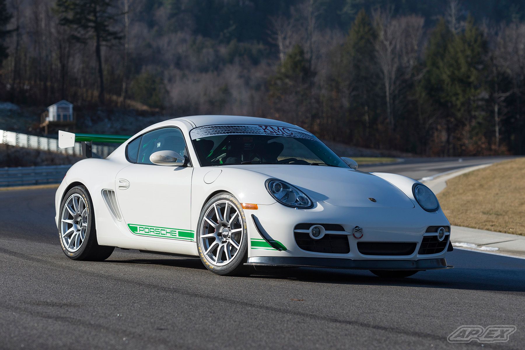 White Porsche 987 Cayman S with 18" SM-10 Apex wheels in Race Silver