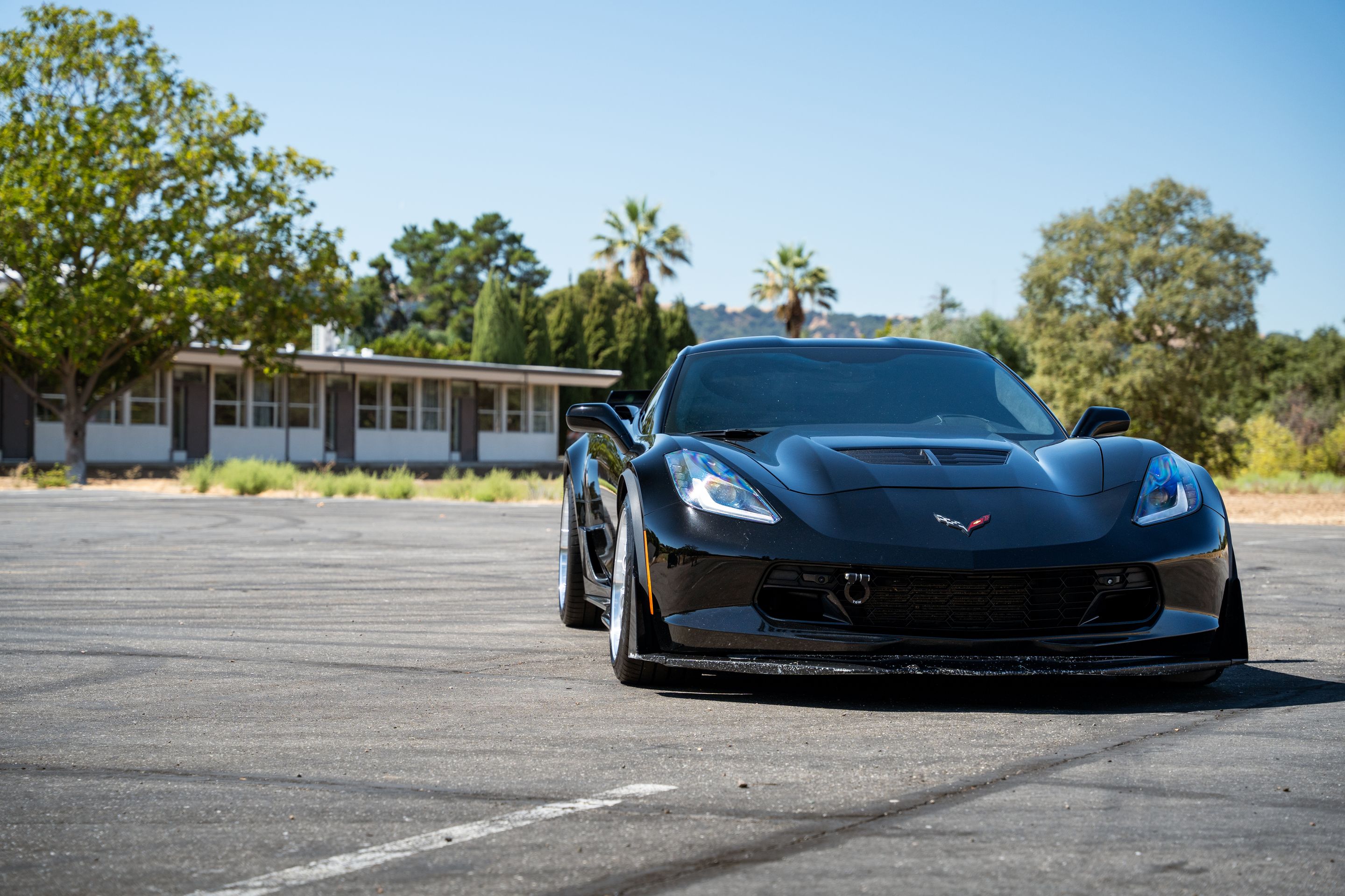 Black Chevrolet C7 Corvette Z06 with 18"/19" ML-10RT Apex wheels in Machined Lip Race Silver