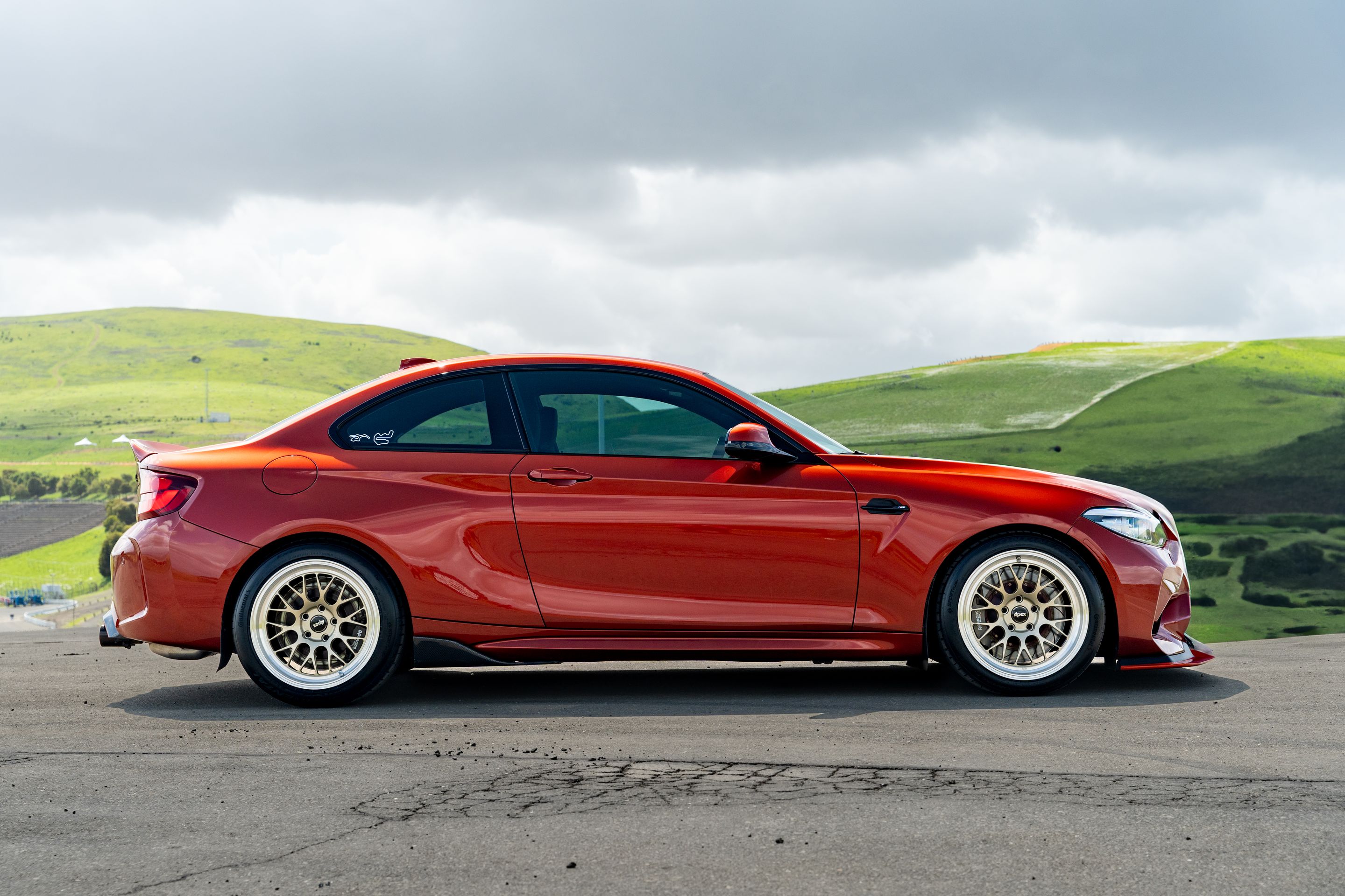 Orange BMW F87 M2 with 18" ML-10RT Apex wheels in Machined Lip Gloss Motorsport Gold