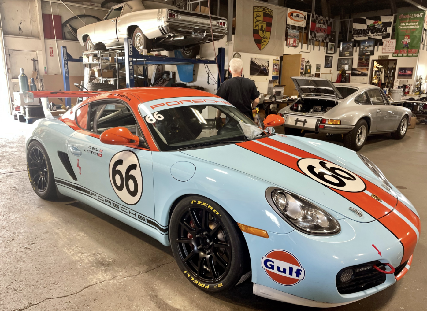 Blue Porsche 987 Cayman S with 18" SM-10 Apex wheels in Satin Black
