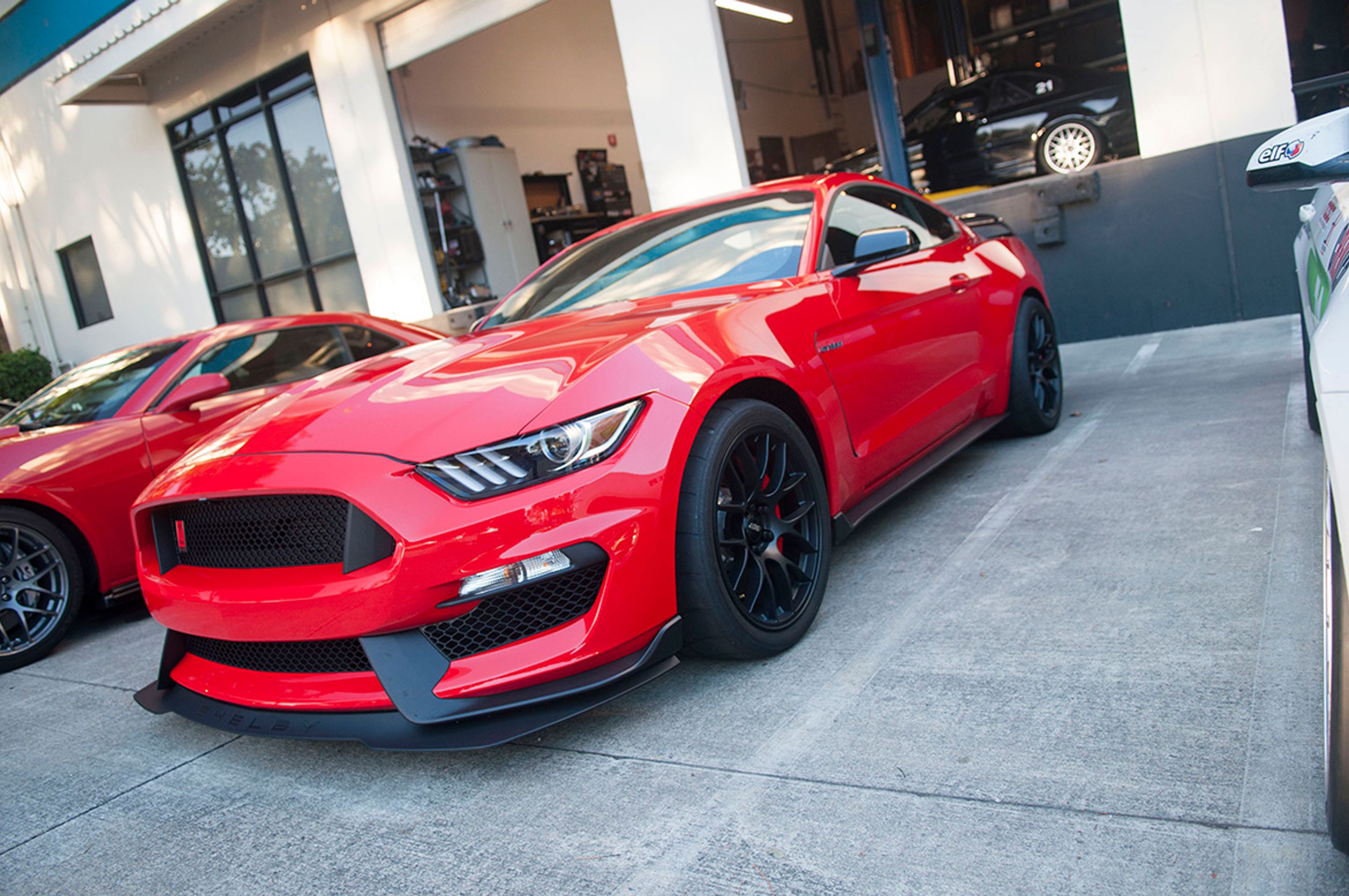 Black Chevrolet 6th Gen Camaro SS with 19" ARC-8 Apex wheels in Satin Black